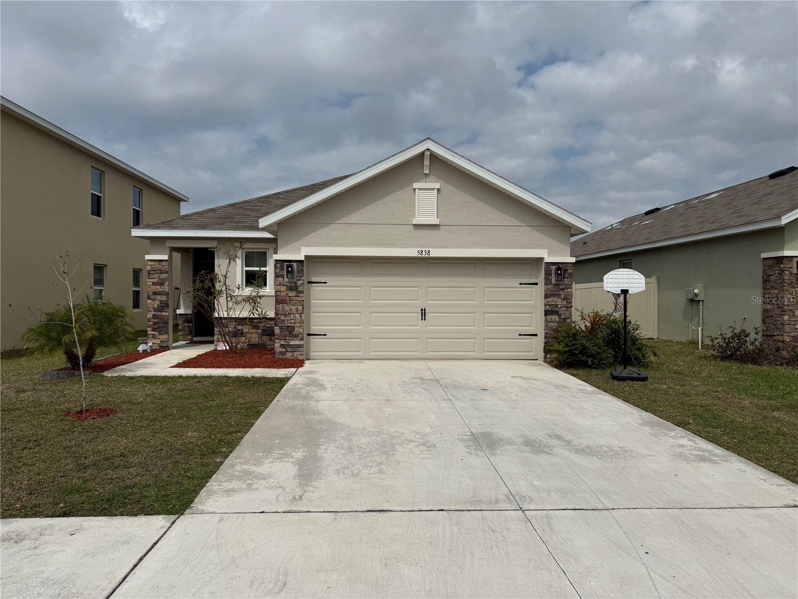 Welcome to this appealing 3-bedroom, 2-bath single-family home located in Garden Village, one of the most affordable gated communities in the area, conveniently located near Cattlemen Road, Fruitville Road, and I-75 (Exit 210). This one-story, all-concrete-block home includes a 2-car garage and a fully fenced backyard. Its open-concept layout maximizes living space, with the kitchen positioned between the living area and dining room. The kitchen overlooks the living area and covered lanai and comes equipped with all major appliances, including a refrigerator, built-in dishwasher, electric range, and microwave. The laundry room also includes a washer and dryer. For added privacy, the owner's suite is located at the back of the home and features an ensuite bathroom. Two additional bedrooms share a second full bathroom. Garden Village offers a convenient location just 30 minutes from Siesta Key Beach and 15 minutes from UTC (University Town Center), as well as the newly opened Mote Science Education Aquarium.