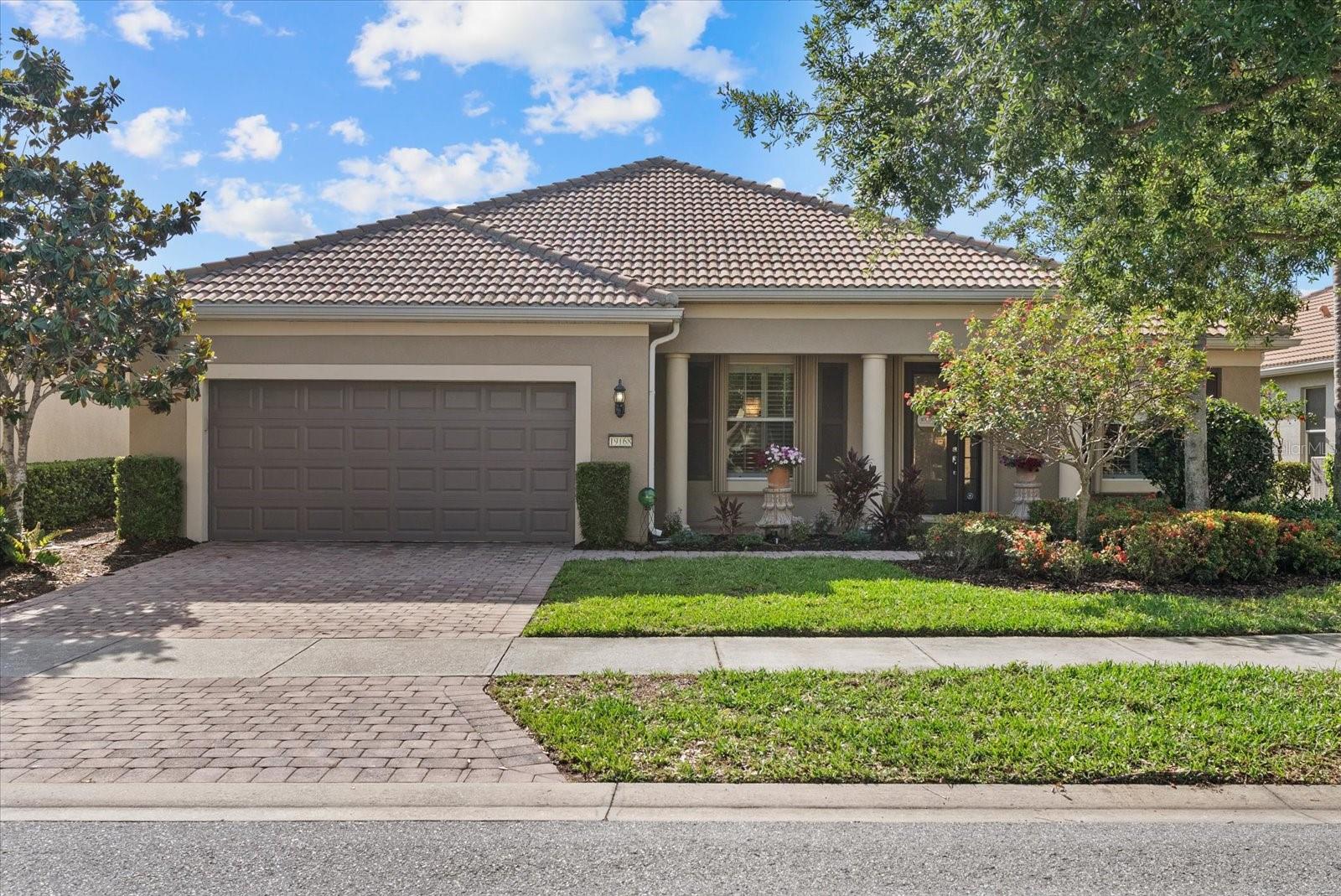 Fully upgraded waterfront pool home in IslandWalk at Wellen Park. This Divosta-built Morningside Lane model offers 3 bedrooms, 3.5 bathrooms, and 2,648 sq ft of air-conditioned living space, plus an additional 966 sq ft of outdoor living on a premium lakefront homesite. Built in 2011 and meticulously maintained, the home features a brand new $90,000 designer kitchen with quartz countertops, custom cabinetry, upgraded lighting, and new stainless-steel appliances including an induction cooktop. Current owner just upgraded the flooring in the entire house at a cost of over $20K (updated pictures coming soon showing new flooring)

Enjoy true Florida outdoor living with a private heated saltwater pool and extended brick paver lanai overlooking the water. Additional upgrades include updated flooring, tile roof, brick paver driveway, custom designer draperies, high ceilings, and an open-concept split floor plan ideal for entertaining.

The extended garage provides additional parking and functionality, complete with overhead storage racks for optimal organization and extra storage space.

Residents enjoy an event center with catering kitchen, billiards, ping pong, darts, bocce courts, and a fire pit. The resort center features pools, hot tub, fitness area, tennis and pickleball courts. Additional amenities include an arts and crafts room, library, massage room, community garden, two dog parks, playground, and outdoor spaces with grills, lounge areas, and pavilion. Conveniently located near shopping, dining, entertainment, and Gulf beaches.

This home offers the perfect combination of luxury, functionality, and resort-style community living. Schedule your private showing today.