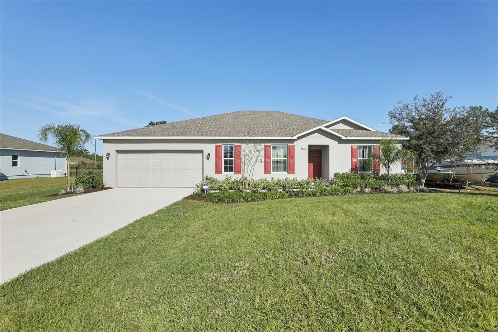 WELCOME HOME to Indian Lake Estates – A Golf & Lake Community! This 4BR/2BA home was a model home for Maronda Homes so it comes with plenty of Upgrades. Ceramic tile flooring is offered throughout, 2,018 square feet of living space, open living room, dining area, and beautiful Kitchen.  The HIGH Ceilings and Large Windows create a light and bright atmosphere. In the kitchen you will find stainless steel appliances, quartz counter tops, soft-close cabinetry and a walk-in pantry. The master bedroom is complete with a large suite, walk in shower, double-sink vanity, and a spacious walk-in closet with the other 3 bedrooms being split on the other side of the home.  Plenty of  storage along with a separate laundry room.  There is a spacious back yard with plenty of room for your pool or outdoor activities. The community is built around a 7,500-acre lake that is the largest in Polk County. Great for fishing and swimming. This community also offers an 18-hole golf course, tennis courts, clubhouse, game room, playground, cafe, post office, churches, library, pro shop and fitness room.