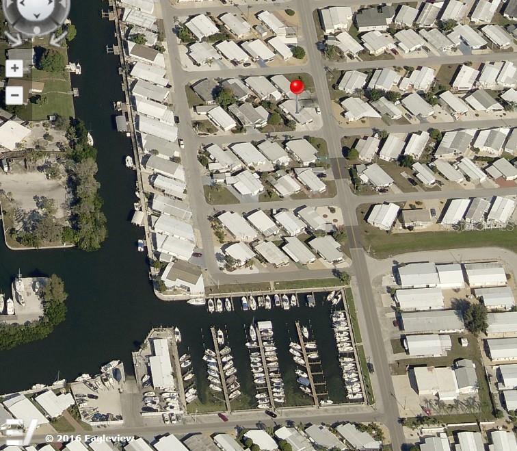 BUT FIRST, LOCATION! Install your new manufactured home on this oversized corner lot in the highly desired, active 55+ LAND OWNED, WATERFRONT Trailer Estates community. Just two short blocks from the Trailer Estates Marina, you can dock your boat steps from your front door! The existing home on this property was removed by the current owner. SELLING LAND ONLY, this corner Lot is 3,441 Square Feet. No lot rent, Park Fees are included into annual real estate taxes. So many activities in this unique community, come take a look! Boaters have direct access to Sarasota Bay from the Marina. Enjoy the large, heated community pool, hot tub, gym and wood shop. The community buzzes with pickleball, shuffleboard, kayaking, horseshoes, bocce, dancing and more. A US Post Office on site. 10 minutes to the SRQ Airport. Convenient to shopping, restaurants, the Arts and everything in/around Bradenton/Sarasota. Sold AS-IS with right to inspect.