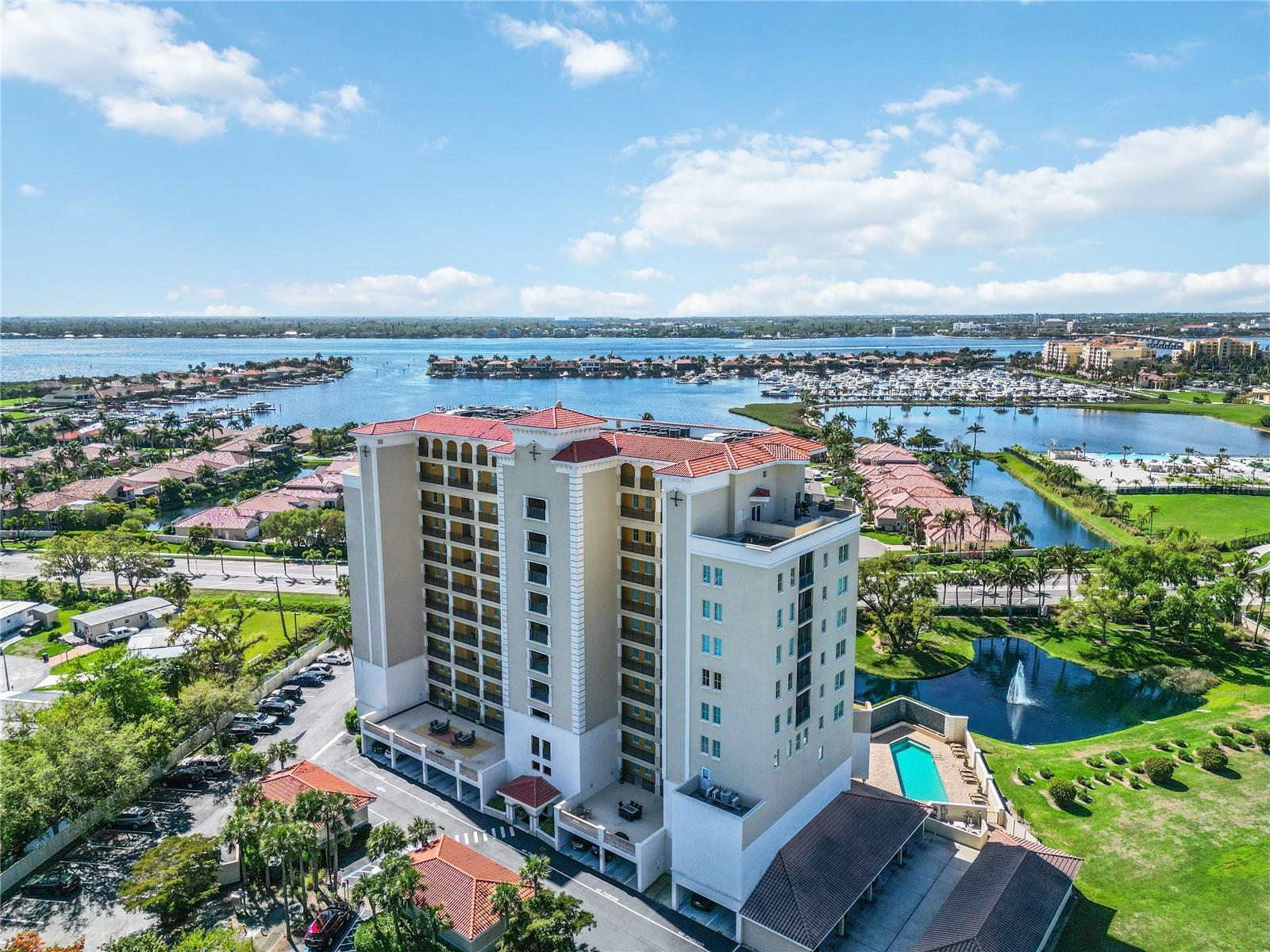 Experience elevated Florida living from the 6th floor at The Palms at Riviera Dunes, a gated waterfront community in the heart of Palmetto. This spacious 2 bedroom + den/home office condo offers upgraded flooring, an open layout, and a large private balcony with beautiful views of the lakes, fountains, and surrounding Riviera Dunes area. Natural light fills the living and dining spaces through oversized sliding glass doors that seamlessly connect indoor and outdoor living.

The kitchen is designed for everyday living and entertaining with granite countertops, stainless steel appliances, rich wood cabinetry, and a breakfast bar overlooking the living areas. The spacious primary suite is a relaxing retreat featuring balcony access, tray ceiling detail, a custom walk-in closet, and a beautifully updated bath with a vessel sink, large shower, and generous storage. The versatile den/home office provides the flexibility to work from home, create a hobby space, or accommodate additional guests. The secondary bedroom offers custom storage space and room for a bed or home office.  

Additional features include upgraded flooring throughout, a laundry area in unit with added storage cabinetry, elevator access, and assigned covered parking, guest parking and a storage unit for your holiday decor and beach gear! Residents of The Palms at Riviera Dunes enjoy resort-style amenities including a pool, fitness center, clubhouse, and beautifully maintained grounds.

Ideally located near the Bradenton Area Convention Center, Riviera Dunes Marina, waterfront dining, shopping, entertainment, downtown Bradenton, downtown Palmetto, and easy access to I-75, this home places some of the area's best destinations within easy reach. Whether you're looking for a full-time residence or seasonal retreat, this condo offers the Florida lifestyle you've been dreaming of.