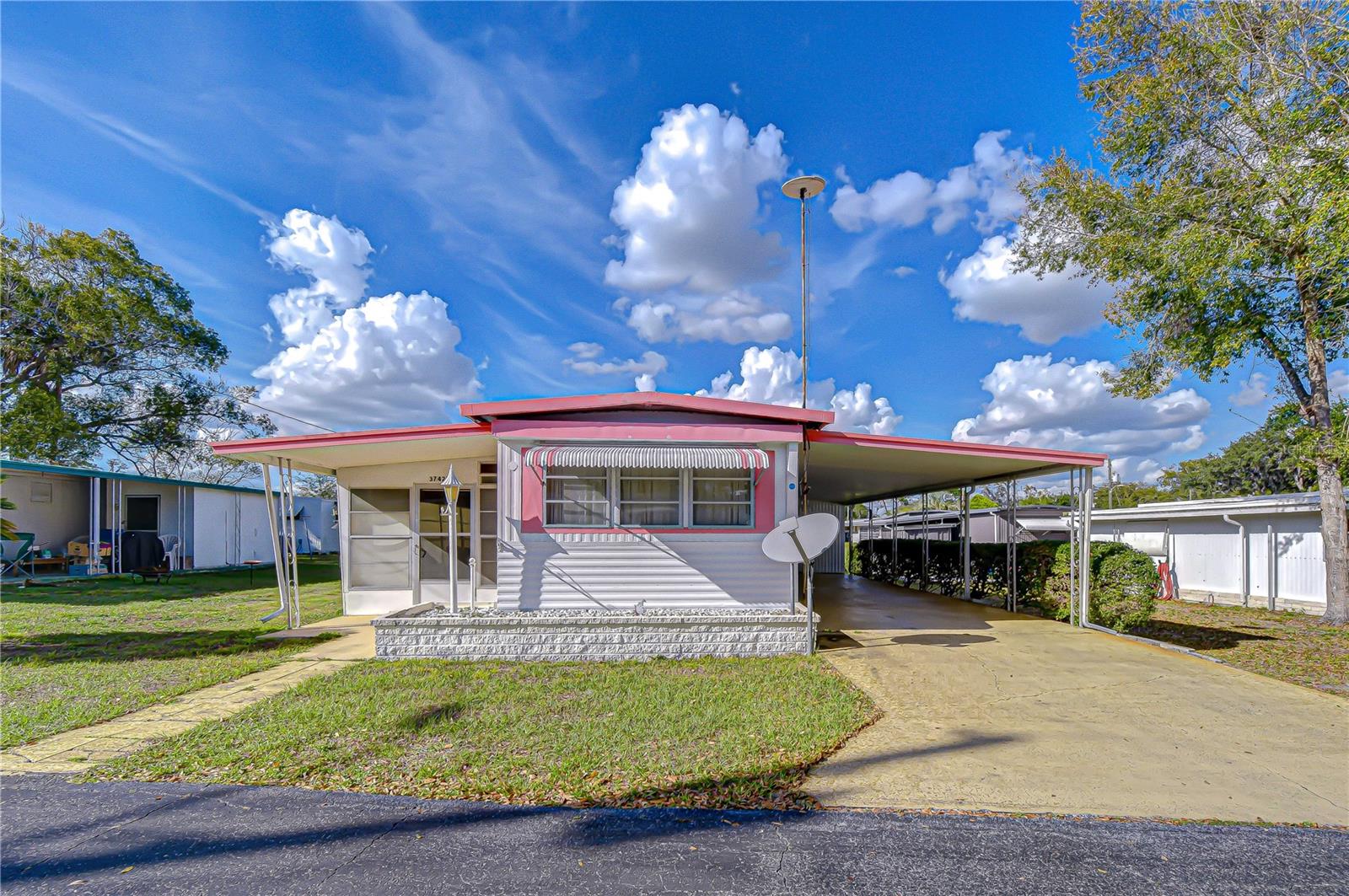 Affordable Opportunity in Zephyrhills!Perfect Winter Retreat or Winter Project. Located on the west side of
Zephyrhills, this 2-bedroom, 1-bath singlewide mobile home offers a great opportunity for someone looking for
an affordable place to make their own. Situated in a quiet senior community with a low HOA fee, this property
is ideal as a winter getaway or a renovation project for the right buyer. Inside, the home features an open floor
plan that creates a comfortable living and dining space. An attached Florida room provides additional living
area, perfect for relaxing or entertaining guests. The washer and dryer are conveniently located in the outdoor
storage shed, offering extra space and functionality. This home does need some TLC, but it has good bones
and plenty of potential. Whether you're looking for an inexpensive seasonal home or a project where you can
update and personalize to your taste, this property is ready for someone to come in and show it some love,
bring your imagination with you and let the fun begin! If you've been searching for a budget-friendly
opportunity in Zephyrhills, this could be the one worth seeing.