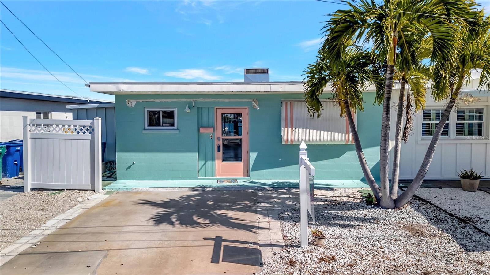 HUGE PRICE REDUCTION – now under $600K! NEW ROOF! Investor alert! Opportunities like this on Anna Maria Island are rare, especially at this price point. Here’s your chance to bring your dream home to life in picturesque Holmes Beach within the transforming Seaside Gardens community. This is your blank canvas to create the ultimate waterfront retreat and boater’s paradise, with no bridges to the Gulf and generous dock potential allowing for quick and easy access to open water. The location is unbeatable, just 0.5 miles to the sugar-white sand beaches and even closer to the vibrant heart of Holmes Beach, where you’ll find charming restaurants, lively taverns, coffee shops, a marina, and more. You can even see the nearby boat launch from the property. For those who enjoy staying active, tennis, pickleball, and basketball courts are all just steps away. Wake up to peaceful views of Watson’s Bayou and design your ideal 2-bedroom island escape. Whether you envision a private coastal getaway or a high-performing short-term rental, the possibilities are exceptional. Don’t miss this opportunity—the island lifestyle has never been more attainable.