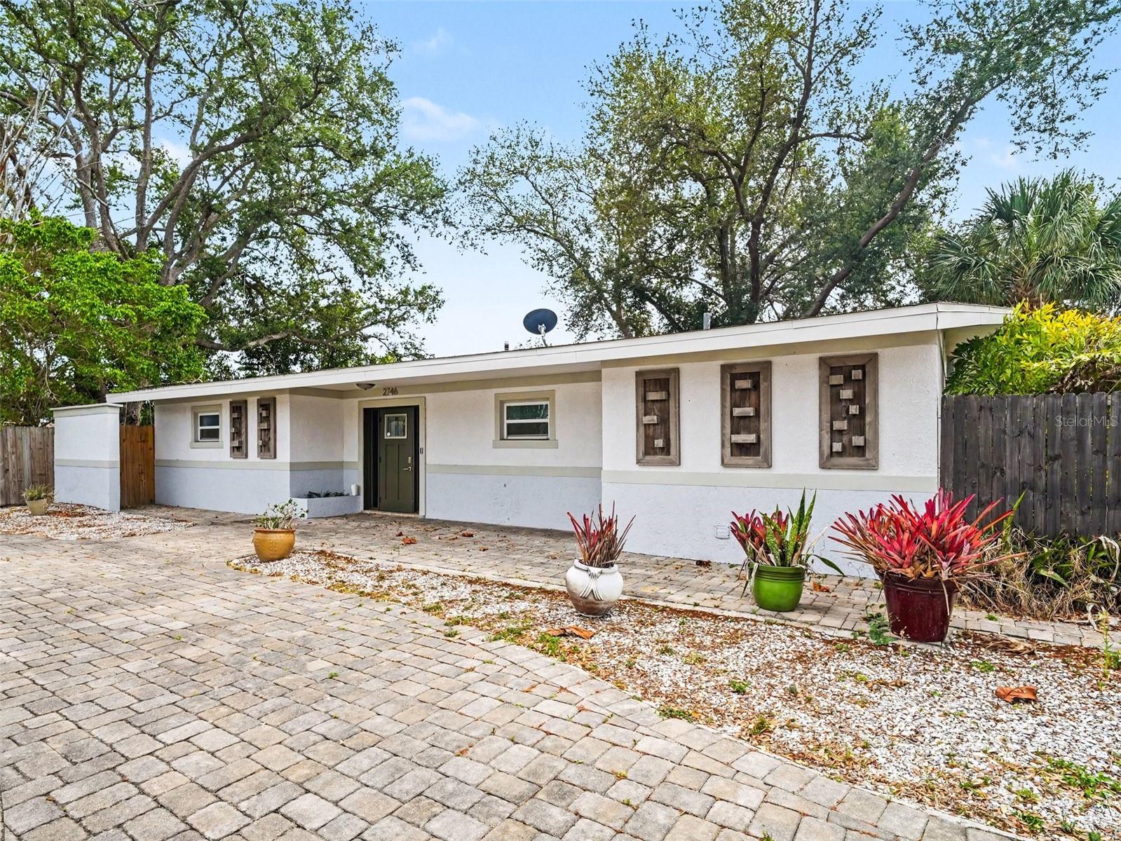 Virtually Staged. Fully renovated Southgate home, set on a spacious, tree-lined corner lot. Ideally located just minutes from Siesta Key Beach, St. Armands Circle, and vibrant downtown Sarasota. 
Step inside to an open, light-filled layout designed for both comfort and entertaining. This 3-bedroom, 3-bathroom home features a desirable split floor plan, providing privacy for family and guests alike, along with a fenced backyard perfect for relaxing or hosting gatherings.
The main bedroom is a true retreat, complete with a walk-in closet and a beautifully updated en-suite bathroom featuring a modern walk-in shower. Two additional bedrooms and full bathrooms complement the home—offering flexibility and convenience for family and guests.  
The interior showcases brand-new flooring and a beautifully updated kitchen equipped with sleek stainless steel appliances, elegant stone countertops, and a striking island with a suspended exhaust hood—perfect for those who love to cook and entertain. Designer lighting throughout adds a refined, modern touch.
The spacious living area centers around a cozy wood-burning fireplace, creating a warm and inviting atmosphere that truly feels like home.
This is a rare opportunity to own a move-in-ready home in one of Sarasota’s most desirable locations.