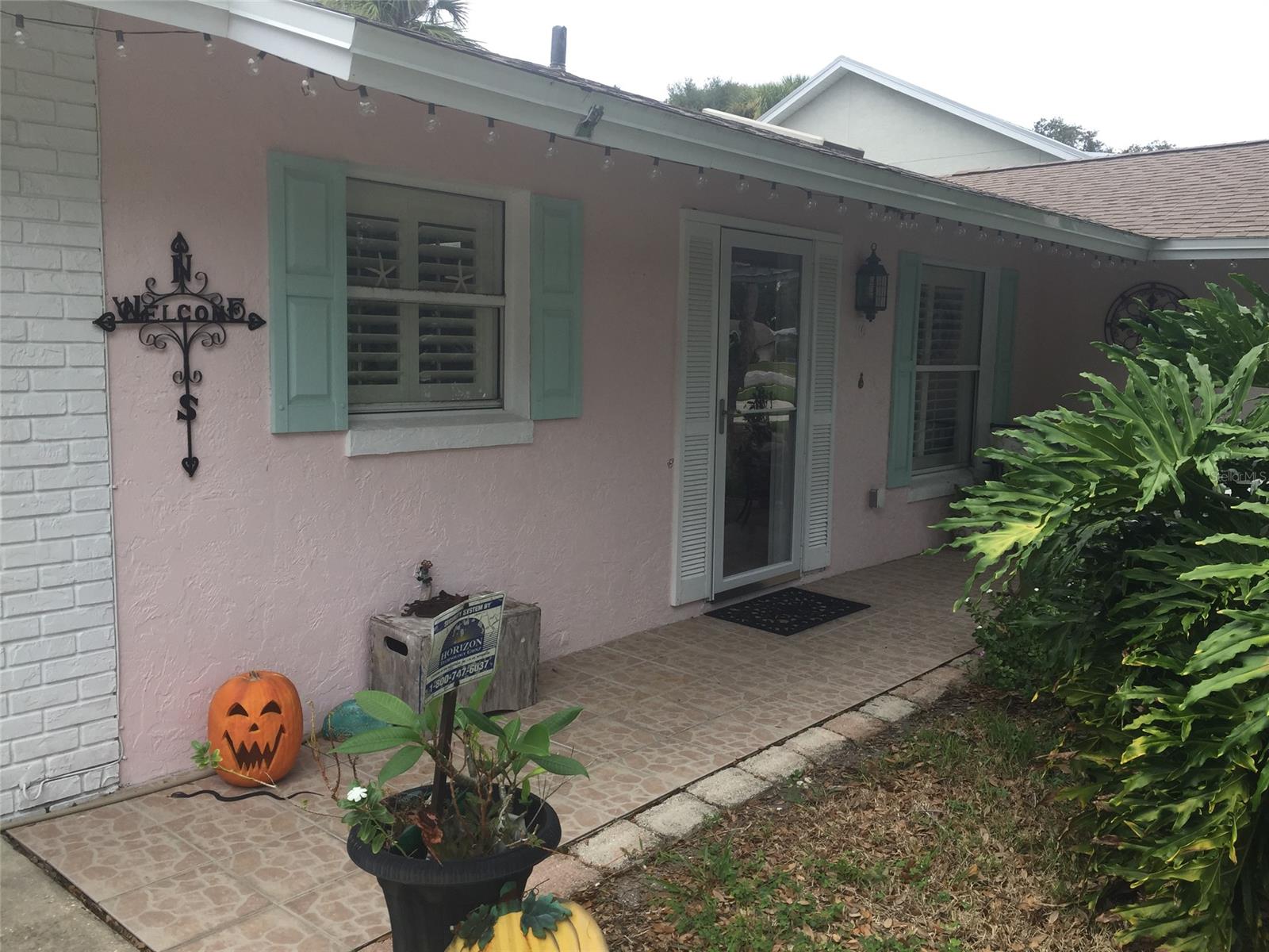 Large private lot surrounds this 2 bedroom 2 bath home with a 2 car garage.  Open floor plan, newer kitchen with updated appliances, quartz countertops, and large kitchen island. Living Room/Dining Room combination overlooking large covered patio.
Tile floors in living areas, Master Bedroom, and office that has an outside entrance.  Within walking distance to Flagler Avenue, Garlic, and shopping.  Roof and patio replaced in 2017.  Large outdoor living space with pavers and wood deck.  Owner/agent. ;Water: City