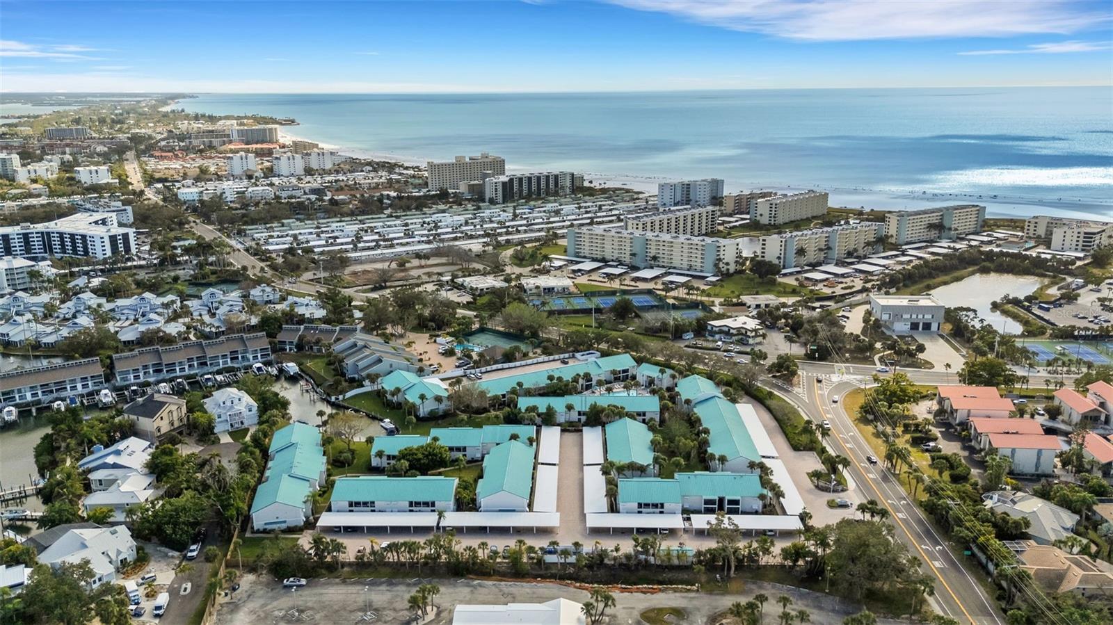 Welcome to coastal living at its best in White Sands Village, a desirable waterfront community ideally located in the middle of Siesta Key and 1 mile from The Village. This charming 2-bedroom, 2-bath end-unit condominium (no flood damage), offering added peace of mind and ease of ownership. The community is surrounded by lush tropical landscaping and features a clubhouse and sparkling community pool, creating a relaxed island atmosphere.

White Sands Village offers water access with Gulf-front amenities and boat slips available via waitlist, perfect for boating enthusiasts. This property may be used as a rental or income-producing investment with a minimum 2-week rental period, making it an excellent option for seasonal use or short-term rental opportunities. Ideally located across the street from world-famous Siesta Key Beach, along with nearby restaurants, shopping, and entertainment, plus convenient on-and-off island access. Whether you’re looking for a full-time residence, vacation retreat, or rental investment, this property delivers the best of the Siesta Key lifestyle.