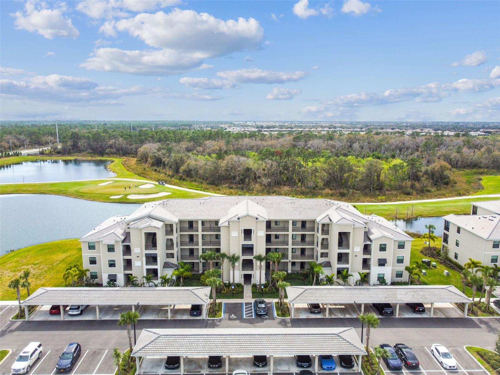 This is your opportunity to experience resort-style living in the premier gated community of Lakewood National. Featuring the most desirable Birkdale floor plan, this is a FIRST-floor, TURNKEY furnished unit overlooking breathtaking water views on the fairway. The primary bedroom features a spacious walk-in closet and an en suite bath with a walk-in shower, accented by a bright quartz vanity. High-quality tile flooring flows seamlessly from the entryway to the open-concept kitchen, living room, breakfast nook, and private lanai.
The kitchen features a large center island and quartz countertops, along with stainless steel appliances, making it the focal point of the home. This luxury community offers the pleasure of enjoying the resort-style pool with a waterfall, hot tub, lap pool, and tiki bar/grill house, as well as a 24-hour fitness center with a sauna and steam room, and tennis and pickleball courts. Enjoy dining at the community’s two restaurants — the poolside Tiki Bar or dinner and cocktails at Deke’s Grill and the Palmer Room inside the clubhouse.
Enjoy the full-service on-site spa to meet all of your needs, and so much more. This home comes with an assigned covered parking spot for your convenience. Lakewood National is located near all that Sarasota has to offer, including SRQ National Airport, top-rated beaches, UTC Mall, downtown Lakewood Ranch, shopping, dining, and Sarasota nightlife. Conveniently located off SR 70 and a short drive to I-75.