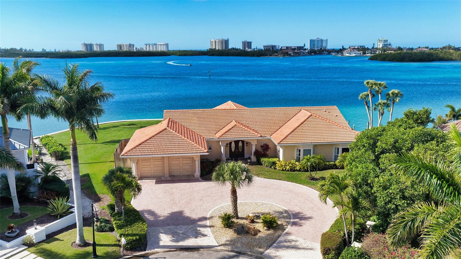 Exceptional Bayfront Lot with home located within the exclusive community of Bird Key.  This unique waterfront lot offers a rare opportunity to purchase over a half acre of prime bay front property offering endless opportunities for new construction.  Boasting 225 feet of seawall frontage, this parcel captures sweeping southwest vistas of Lido Key, Big Pass, and Otter Key.  Protected waters provide the ideal location for the most avid boating enthusiasts.  The three bedroom, three and half bath single family  home with heated pool and spa captures Florida's true waterfront lifestyle.  Spacious living areas take full advantage of the views overlooking the bay with spectacular sunsets perfect for entertaining or simply enjoying the serenity and tranquility of coastal living.  This is truly waterfront living at its finest.  Bird Key offers a unique lifestyle for the most discerning buyer with close proximity to St Armands Circle, Longboat Key, and vibrant downtown Sarasota - the perfect balance of privacy and convenience.  Residents may also enjoy membership to the Bird Key Yacht Club, which is currently undergoing a complete rebuild.  The Yacht Club offers access to a myriad of activities including tennis, pickle ball, fitness facilities, dining, and social events.  This home is being sold "as is" with the right to inspect.