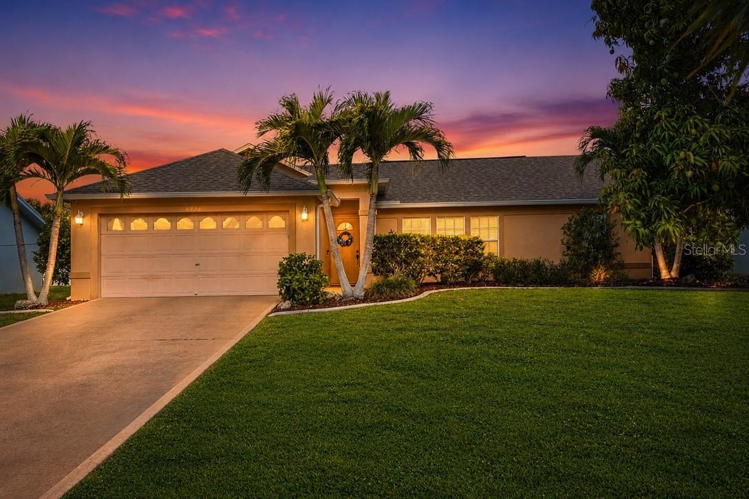 WESTERN EXPOSURE, UPDATED AND PERFECTLY POSITIONED IN SOUTHWEST CAPE CORAL. This renovated Cape Coral home offers a bright, inviting interior with vaulted ceilings, tile flooring, and an open layout that feels both comfortable and functional. The kitchen features white shaker cabinetry, a brick tile backsplash, a large sink, silver appliances, and a movable butcher block island for added prep space and flexibility. A built-in desk area provides a convenient spot for work, organization, or additional storage. The split bedroom floor plan offers privacy and everyday convenience, with well-sized bedrooms and updated bathrooms. The primary suite features an en suite bath with a spacious tiled walk-in shower, along with private access from the bathroom to the lanai for added convenience and easy indoor-outdoor living. Step outside to the covered screened lanai overlooking a fenced backyard with room to relax, entertain, garden, or enjoy the Florida sunshine. A shed with electricity adds valuable storage and utility, making the outdoor space even more practical. The home has experienced no flooding from any storm, and an assumable flood insurance policy is available for approximately $1,679 annually. Located in a desirable Southwest Cape Coral area, this home places you close to Cape Harbour, boating, marinas, waterfront dining, restaurants, shopping, grocery stores, and everyday conveniences. With updated interiors, functional living spaces, and a location near everything that makes Southwest Florida so desirable, this home is one you will want to see in person.