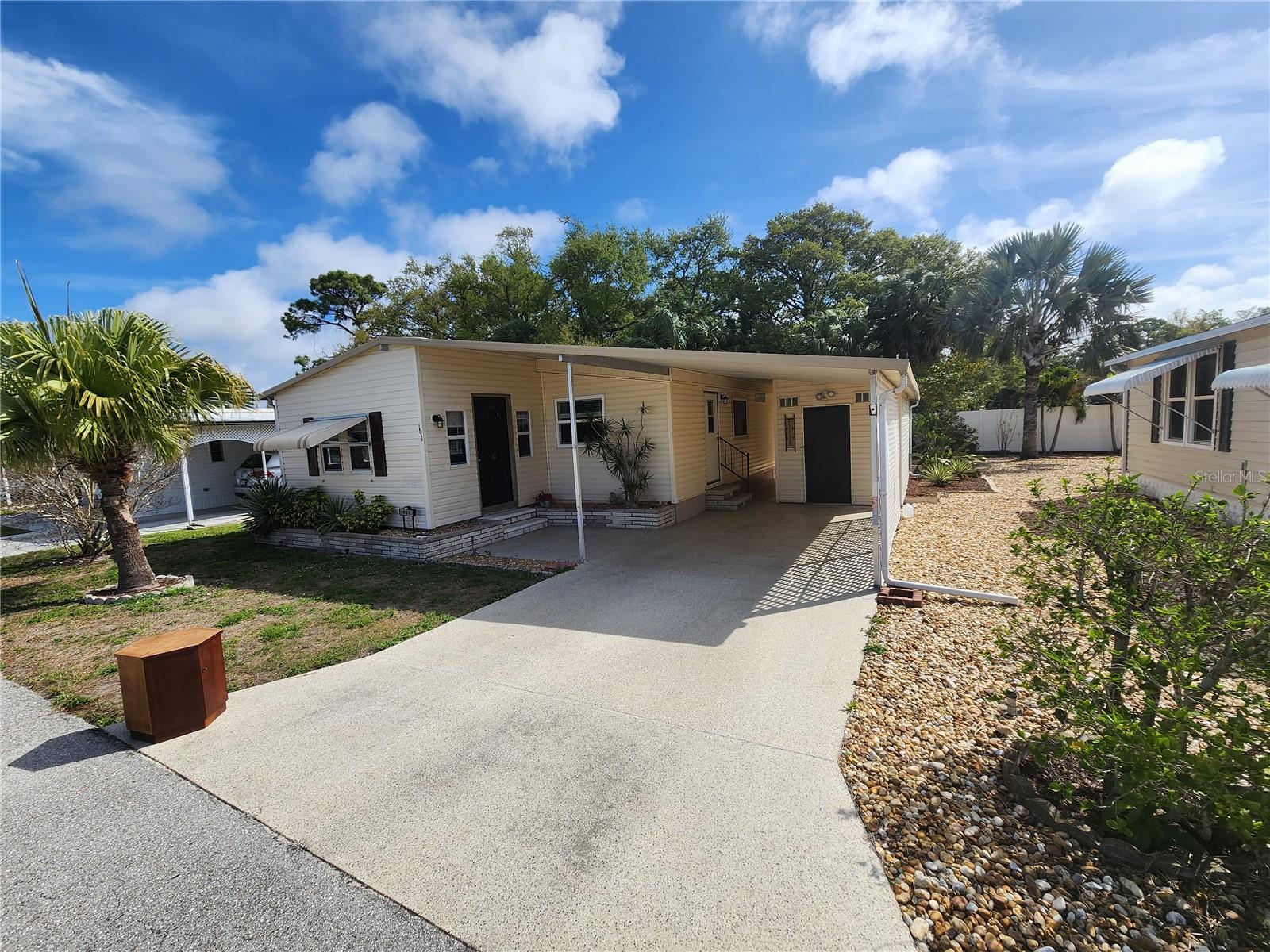 PRICE ADJUSTED TO $144,000.  AFFORABLE LIVING!!  NO LOT RENT!! LOW MAINTENANCE FEE!!  Welcome to Palm Lake Estates, a well-maintained and active 55+ community offering comfort, convenience, and low-maintenance living. This updated two-bedroom, one-and-a-half-bath home is ready for its new owner and comes unfurnished, allowing you to make it your own.
Recent updates include windows, roof, A/C, kitchen cabinets and countertops, plywood subfloors with new flooring, vapor barrier, toilets, sinks, vanity, and new ceiling fans, providing peace of mind and modern comfort. The home also features a bright Florida room for additional living space and a backyard patio perfect for relaxing outdoors. Sprinklers are in place and operational to help maintain the landscaping.  Additional highlights include an extra-large utility shed with washer and dryer hookup and plenty of storage space.
Palm Lake Estates offers NO LOT RENT and a low maintenance fee of only $275/month, which includes water, sewer, trash, cable, internet, lawn care, on-site manager, clubhouse, community pool, and security.  Conveniently located minutes from shopping, restaurants, the airport, and the beautiful beaches of Anna Maria Island, this home is a wonderful opportunity to enjoy the life style you deserve.