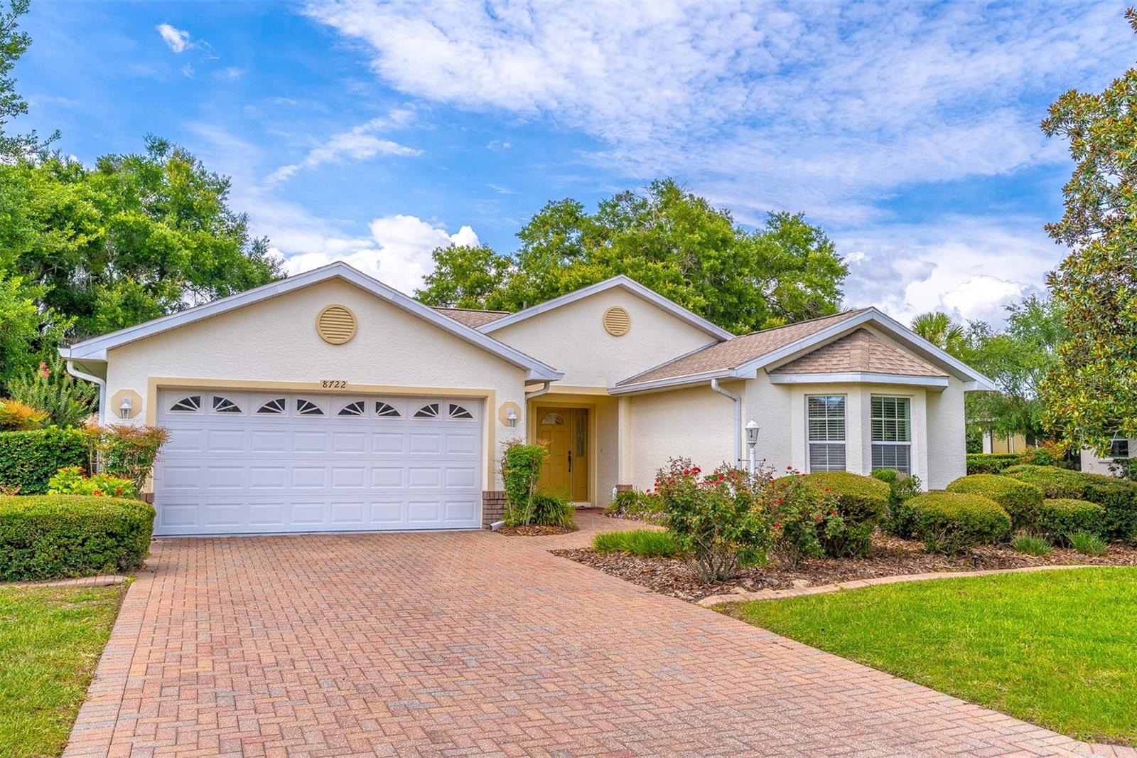 One or more photo(s) has been virtually staged. If you want to live in the ultra-desirable Candler Hills section of the award-winning On Top of the World Community at an unbelievable low price, with a New 2023 Roof and a Home Warranty, this is it!  At this price you can brag about it or just keep it your little secret.
  As you drive through the Candler Hills Guard Gate you will see stunning views of the golf course, on both sides of the street, all of the way home to your new house.  
   You will pull into the brick paver driveway and see the Southern Magnolia Tree in the front yard. This 2 Bedroom, 2 Bath, 2 Car Garage IRIS was a former model home.  You have a view of the golf course across the street from the bay window in your kitchen nook and from the bay window in the guest bedroom.  Your guests may never leave.
   This is an Open Layout filled with natural light, Vaulted Ceilings, Sunroom, Split Bedroom floorplan, Tile Floors throughout, Carpet in the bedrooms and you can pick the color of your carpet with your $2000 carpet credit, Indoors under air Laundry Room with built in cabinets and a utility sink.  
   Enjoy watching the video tour of this home. The exclusive amenities for residents of Candler Hills include The Lodge Pool Clubhouse and Ballroom, The Candler Hills Pool and Clubhouse and the New Azura Fitness Center opening in 2026. The mail delivery and trash & recycling pick up is right at your house. Very Convenient. You are also welcome to use all of the OTOW amenities including the brand New Summit Pool & Clubhouse, The Arbor Club, The Recreation Center, the 3 golf courses, 2 Fitness centers, Indoor and Outdoor pools, Pickleball, Tennis, Farmers Market, Restaurants, The Cultural Arts Center and Live Music and Dancing on the Town Square. This is where resort-style living is a way of life.  Come and Enjoy!