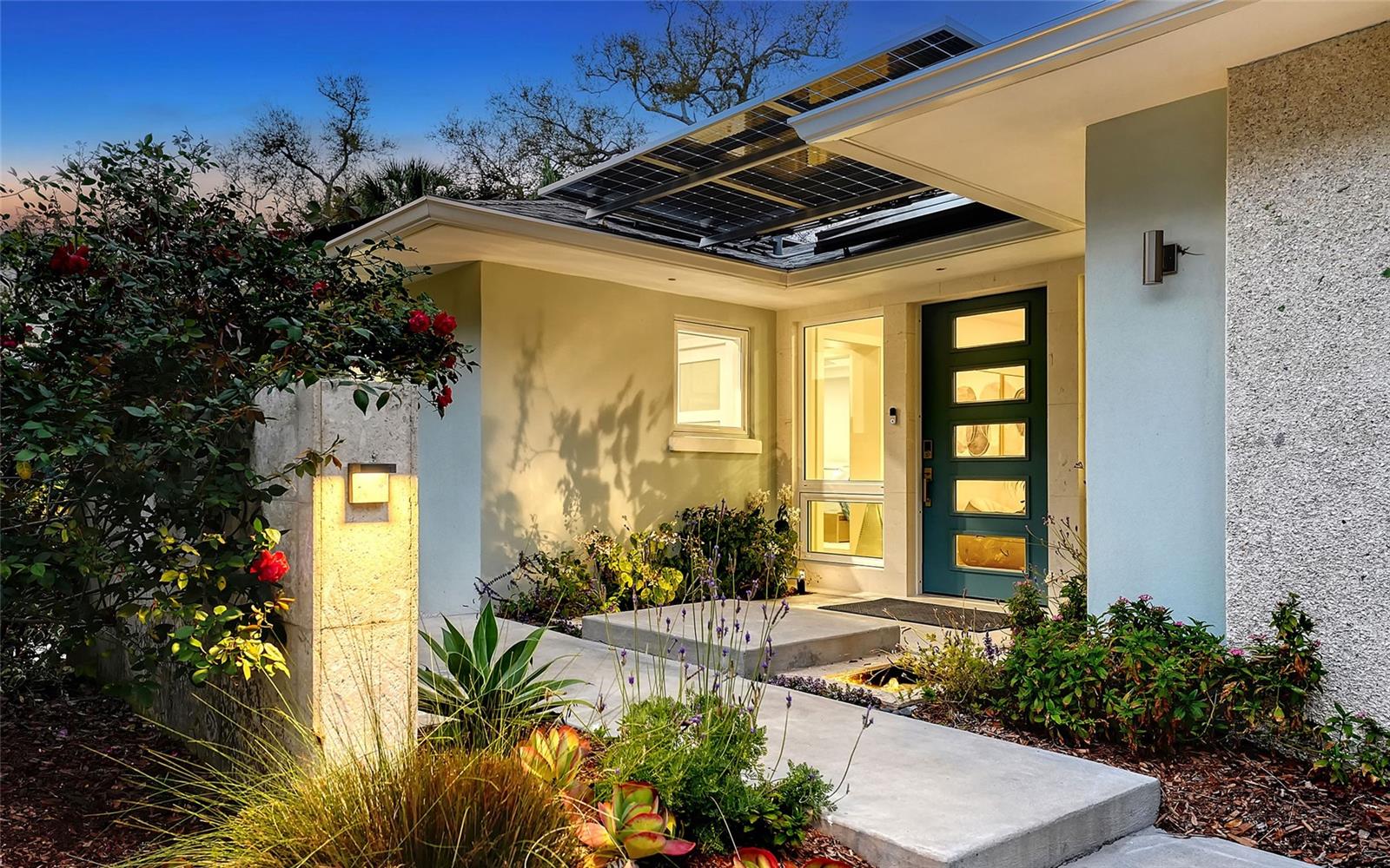 Hidden behind lush, curated gardens on a rare .34-acre parcel in McClellan Park, west of Osprey, this is more than a home—it’s a private in-town compound designed for those who value beauty, privacy, and a deeply connected lifestyle. A winding approach reveals a residence that unfolds with intention, where indoor and outdoor living exist in perfect harmony. At its heart, a 2024 architectural addition creates a breathtaking great room, where walls of glass disappear and the home opens entirely to a serene poolside setting—blurring the line between interior elegance and natural surroundings. The kitchen, dining, and living spaces flow effortlessly together, framed by garden views and natural light, creating an atmosphere that is both refined and grounding.

This charming in-city home combines historic character with modern living. The property underwent a complete back-to-studs renovation, bringing it fully up to current Florida building codes with an official build date of 2013. You’ll enjoy the best of both worlds: a classic foundation refined by modern systems and standards.

The main home spans 3,239 square feet with three bedrooms and three baths, fully customized with all the details valued by today’s buyers. Bonus rooms include an office/den, plus a sitting room in the primary suite. The striking 2024 addition, designed by Jimmy Thornton, features an open-concept great room, dining and kitchen with zero-corner, fully pocketing sliding glass doors, a dramatic architectural detail that opens the living space completely to the pool and outdoor areas.

The kitchen is a true showpiece. It features high ceiling, super-organized European cabinetry with illuminated interiors, high-profile quartz and marble countertops, a glass window backsplash, and clerestory windows. Custom walnut open shelving add artistic flair. Appliance garages, interior drawers, workstation sink with two faucets, and oversize eat-in island add high-end functionality.

The outdoors is incredibly lush and functional for an in-town location. Outdoor living rooms, fruit trees, trellises, native flowers, and an expansive food garden…plus a tree house for charm and fun. A heated saltwater pool anchors the backyard, while the detached guest house adds flexibility for recreation, home office, studio or guests.

Energy independence is a standout advantage with a roof solar system, two-car solar carport, and backup batteries. It’s a home that powers itself confidently and efficiently.

Location is a major benefit here, and one you’ll appreciate every day. From this quiet McClellan Park street, you can walk to Southside School (or the Pine View bus stop), reach Southside Village in 0.5 mile, and be at Sarasota Memorial Hospital in 1.0 mile. Everyday convenience continues just beyond the neighborhood with shopping centers, restaurants, Downtown Sarasota and Gulf beaches all within five miles. And for buyers who love being on the water, you can roll your kayaks to the bay. There’s a convenient put-in at the end of the street.

McClellan park homes like this one are few and far between. Quiet street, large lot, guest house and a full renovation already done. If you want Sarasota West of Trail without compromise, this is your moment.