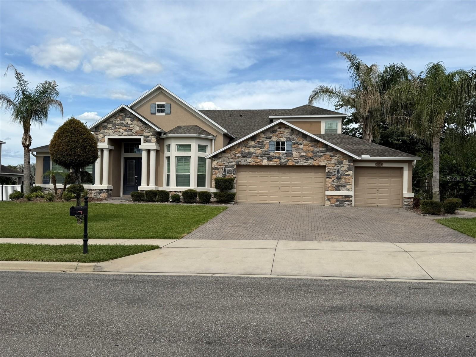 Beautifully maintained pool home in the desirable Wekiva Run community, featuring a striking stone exterior, paver driveway, three-car garage with a new opener (2026), and a fully fenced yard with mature landscaping. Major updates include a new roof installed in May 2026, luxury vinyl plank flooring throughout, and a saltwater pool with a new salt cell. The spacious floor plan offers formal living and dining areas, a dedicated home office, and a large family room with an electric fireplace and expansive sliding glass doors that fully open to create seamless indoor-outdoor living. The gourmet kitchen features granite countertops, newer stainless steel appliances, abundant cabinetry, and a breakfast nook. The oversized primary suite includes dual vanities, separate his-and-hers closets, a garden tub, and a walk-in shower. Upstairs, a large loft provides additional living space along with a private bedroom and full bath, ideal for guests or multigenerational living. Outdoor amenities include a covered lanai, paver pool deck, firepit, pond views, shooting pool fountains, solar-ready pool hookups, and an irrigated garden area. Additional highlights include a separate laundry room with washer and dryer, transferable termite bond, and convenient access to major roadways, schools, the Apopka Amphitheater, and local sports facilities. Wekiva Run residents enjoy gated community access, a neighborhood park, and app-controlled vehicle and pedestrian entry points.