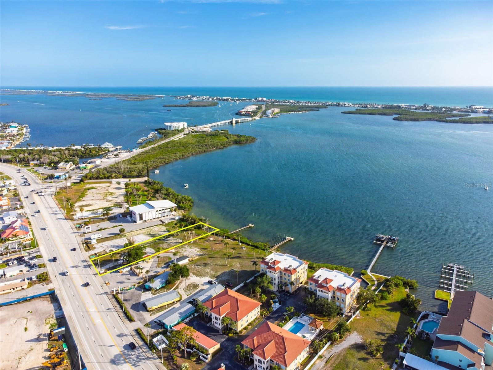 UNRIVALED WATERFRONT OPPORTUNITY ON LEMON BAY! HIGH TRAFFIC, HIGH VISIBILITY! Rarely does a canvas of this magnitude and potential become available in the heart of Englewood. Situated directly on the sparkling waters of Lemon Bay, this expansive vacant land parcel offers a premier location with high visibility and INCREDIBLE VERSATILITY. While zoned OMI (Office, Medical, and Institutional) for professional, medical, or institutional use, this property is a strategic powerhouse exceptionally well-suited for MULTI-FAMILY Residential development. The ultimate value of this site lies in its ZONING FLEXIBILITY, which allows a visionary developer to transform this waterfront parcel into a LUXURY CONDO development, duplexes, triplexes, or a  RESORT-STYLE VACATION COMPLEX. For buyers with a personal legacy in mind, this massive parcel also offers the rare and magnificent opportunity to build an expansive, generational family compound. Imagine creating a private, multi-home estate where multiple generations can live side-by-side, sharing a sprawling waterfront sanctuary while maintaining individual privacy. With DIRECT BAY FRONTAGE and the capability to install PRIVATE DOCKS and BOAT SLIPS, this property offers an unmatched foundation for a lucrative waterfront community!
This isn't just a piece of land; it is a gateway to the absolute highest-demand destinations on the Gulf Coast. Location is everything, and this parcel puts the best of the area right at your fingertips. You are located just 1 mile from the pristine sands of Englewood Beach and Manasota Key, allowing residents, family, or vacation guests to quickly immerse themselves in the island's vibrant social scene, complete with sunset views and popular local restaurants featuring live music. Additionally, you are only 1.5 miles away from historic Dearborn Street and Pioneer Plaza, the cultural heart of Englewood known for its boutique shops, local dining spots, weekly farmers markets, car shows, and lively community festivals.
Englewood is experiencing an incredible wave of growth, and premium waterfront land with this level of versatility is rapidly disappearing. Whether you choose to leverage the OMI zoning for a landmark commercial development, seize the massive income potential of a high-yield residential or vacation resort complex with boating amenities, or build a one-of-a-kind generational family compound to pass down for decades to come, 1144 S. McCall Rd is ready to become a cornerstone of the community. Don't miss your chance to secure one of the most prominent waterfront parcels in the region and capitalize on a high-return investment where the bay meets endless potential. (Adjacent property next door is also for sale to potentially maximize your investment) Schedule your private viewing today and start building your coastal vision!