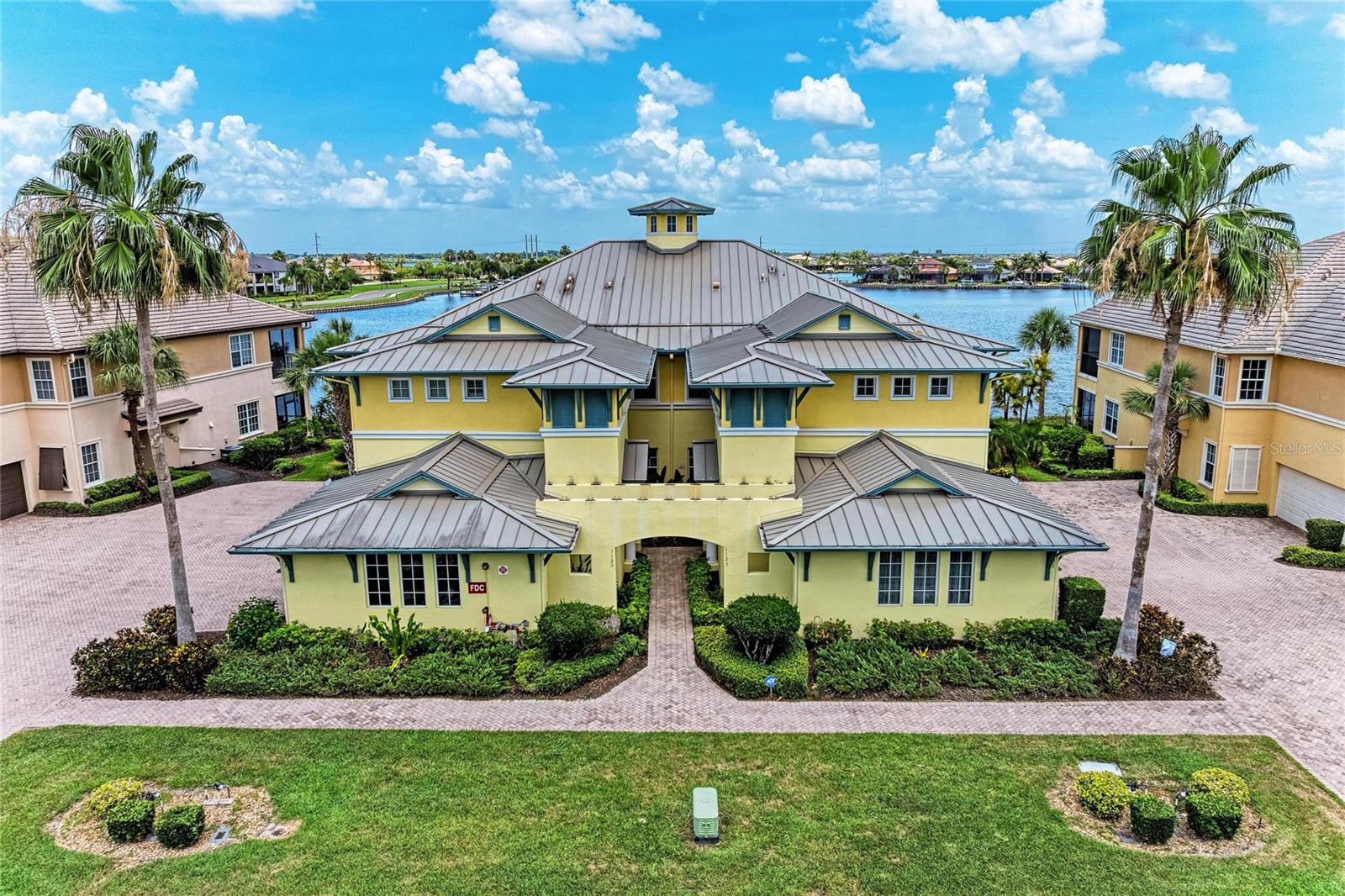 EXCEPTIONAL WATERFRONT residence in the beautiful BOATING community of TIDEWATER Preserve, where refined coastal living meets resort-style luxury along the scenic Manatee River. This beautifully updated waterview condominium offers a blend of elegance, comfort, and effortless Florida living, all framed by breathtaking panoramic water views and unforgettable sunsets from the expansive screened lanai.
Designed with an open-concept floor plan and an abundance of natural light, the residence showcases soaring tray ceilings, oversized windows, and seamless indoor-outdoor living spaces that capture the beauty of the surrounding waterfront setting. The spacious living and entertaining areas flow gracefully to the lanai, creating the perfect backdrop for relaxing mornings, elegant evenings, and year-round entertaining.
The designer-inspired kitchen was thoughtfully updated in 2021 and features luxurious quartz countertops, stainless steel appliances, abundant cabinetry, and two inviting dining spaces — including an intimate breakfast nook overlooking the water and a spacious formal dining area ideal for hosting guests. Fresh interior paint, warm wood-look luxury vinyl flooring, upgraded ceiling fans, plantation shutters, and custom retractable privacy shades throughout the home elevate the residence with timeless sophistication.
The luxurious primary suite is a private retreat featuring tranquil water views, tray ceilings, a spacious walk-in closet, and a spa-inspired ensuite bath complete with dual vanities, granite countertops, rich wood cabinetry, and an upgraded custom privacy glass shower installed in 2021. Wake each morning to serene waterfront vistas and enjoy direct access to the lanai where gentle river breezes create the ultimate coastal ambiance.
The expansive screened lanai was designed to maximize the stunning views of the Manatee River and abundant aquatic wildlife, offering one of the most desirable waterfront perspectives within the community. Enhanced with surround sound capabilities, remote-controlled retractable sunshades with a 10-year warranty, and a newly installed hurricane-rated screen enclosure, this outdoor living space is both luxurious and functional.
Additional premium upgrades include a METAL ROOF, updated garage door systems including motor, springs, and chain guide replacement in 2021, as well as in ceiling-mounted garage storage solutions that maximize functionality without sacrificing usable space.
Residents of Tidewater Preserve enjoy an extraordinary waterfront lifestyle with exclusive access to world-class amenities including a private marina with boat slips and lift access, direct boating access to the Gulf of Mexico, a riverfront walking trail, kayak launch, resort-style swimming pool, state-of-the-art fitness center, playground, and the elegant Port & Court Club featuring lighted Har-Tru® tennis courts and a ball machine. Whether enjoying a day on the water, sunset cruises, fishing excursions, or simply embracing the relaxed sophistication of this gated boating community, every day feels like a luxury retreat.
Ideally located in Bradenton, just moments from premier dining, shopping, beaches, and the Gulf waters beyond, this exceptional waterfront residence offers a rare opportunity to experience elevated coastal living at its finest.