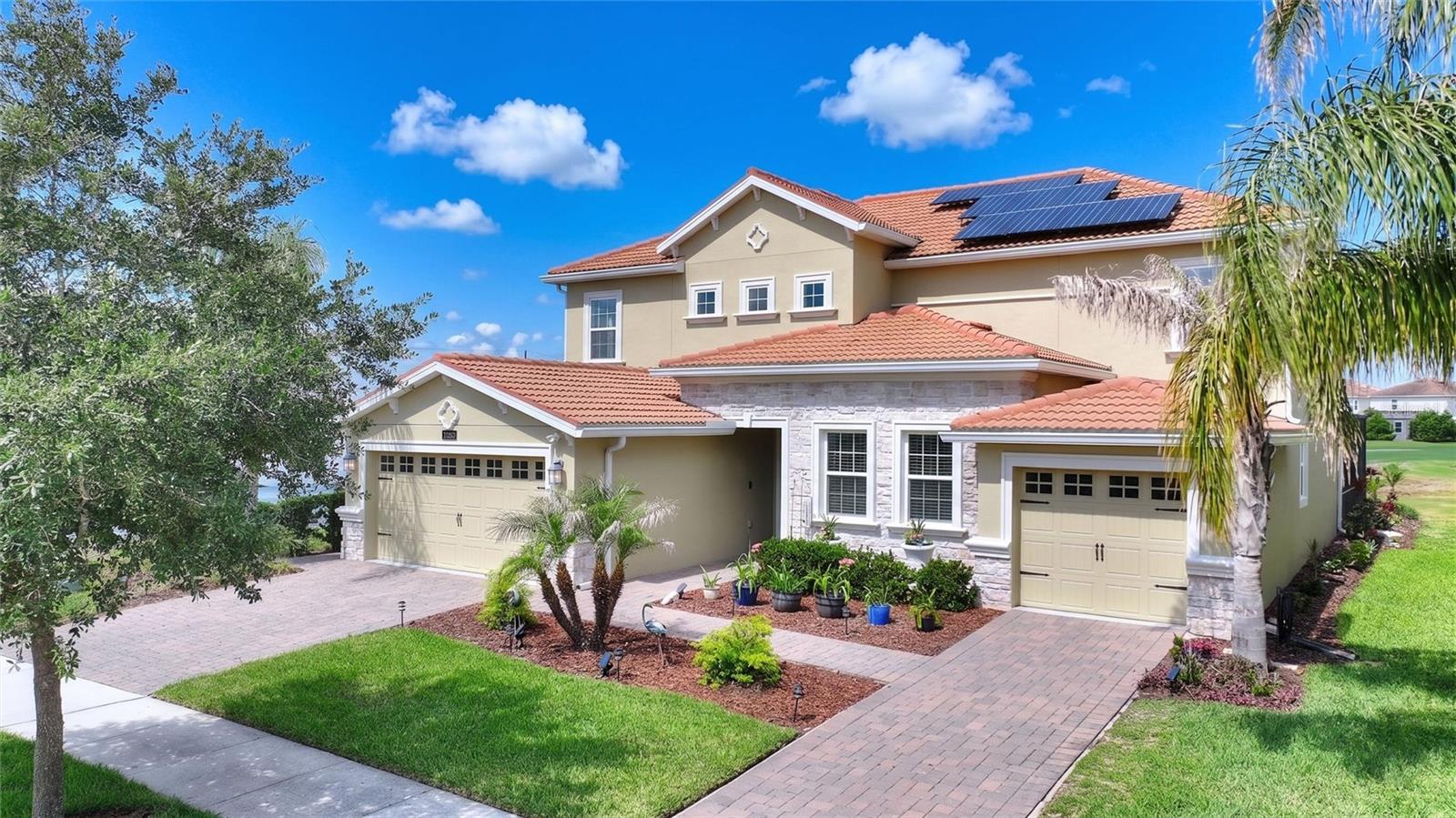 Absolutely flawless! Stunning Next-Gen Liberation Model with private In-Law Suite located on one of the most spectacular lots inside the exclusive gated community of ChampionsGate Country Club! ***GOLF COURSE FRONTAGE | PREMIUM LOT | SALTWATER POOL | PAID-OFF SOLAR !*** Opportunities like this rarely come available. Perfectly positioned on the 8th hole, this beautifully upgraded 6-bedroom, 4.5-bath home offers breathtaking panoramic views of the golf course, pond, fountains, and putting green right from your oversized screened lanai. Enjoy fireworks, hot air balloons, and one of the most impressive backdrops in the community. The exterior of the home has recently been painted, giving the property incredible curb appeal. The paid-off solar system is a massive bonus, with the current owners averaging approximately just $33 per month in electric bills — even while heating the saltwater pool. Inside, the home shows like new and features an open-concept floorplan ideal for entertaining, complete with upgraded 42” cabinetry, crown molding, quartz countertops, and solid-surface flooring throughout. The owners also invested approximately $7,000 in additional recessed can lighting throughout the home, creating a bright, modern luxury feel in every room. The private attached Next-Gen suite is perfect for multigenerational living and includes its own separate entrance, living room, kitchenette, bedroom, full bath, laundry area, and private one-car garage. ChampionsGate Country Club offers one of the most complete lifestyle packages in Central Florida. HOA includes full golf and tennis membership for the family, access to The Oasis Club, The Plaza, and the Retreat Club water park, gated entries with 24-hour manned security, complete lawn care, trash service, security monitoring, cable, phone, and internet. CDD is included in the taxes. The Oasis Club is a 14,000+ sq ft resort-style clubhouse featuring a restaurant, movie theater, fitness center, game room, tiki bar, lazy river, waterslides, cabanas, and more. Residents also enjoy access to The Plaza, the residents-only clubhouse featuring another restaurant, bar, fitness center, game room, pool, and a $75/month food and beverage credit. In addition, owners have access to the Retreat Club water park, creating one of the most impressive amenity packages anywhere in Central Florida. This is luxury Florida resort living at its finest — an elite home, on an elite lot, with one of the strongest lifestyle and amenity packages in ChampionsGate.