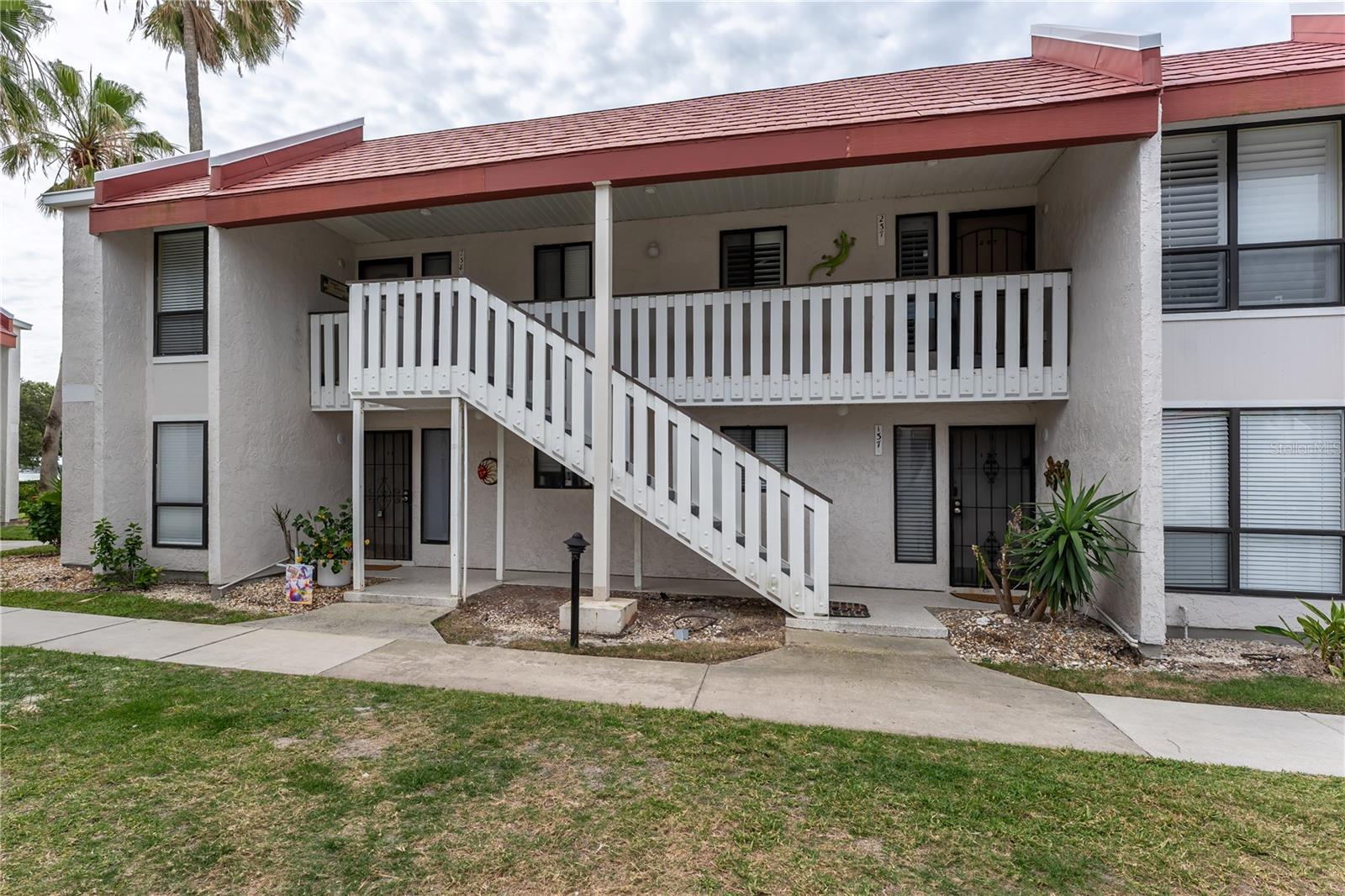 PRICE IMPROVEMENT! Opportunity, opportunity, opportunity! Here is your chance to have your own coastal paradise at Runaway Bay on Anna Maria Island. This beautifully decorated, income producing 2 bedroom and 2 bathroom, second floor condo with a new roof is an exceptional investment opportunity in the highly desirable community of Runaway Bay in Bradenton Beach. With it's prime bayside location, the beach & island life includes access to the stunning sugar sands of the Gulf of Mexico, just steps away. Enjoy the community's fishing pier and kayak launch on the bay, perfect for sunrise views, fishing, and water sports. Perfectly positioned near the free Anna Maria Island trolley stop for easy access to Historic Bridge Street, local dining, shops, and the entire island. The Runaway Bay community permits weekly rentals, offering maximum flexibility and proven, strong rental income potential. Units here are highly sought after for short-term vacation stays.  Unit #238 comes turnkey furnished and updated, with reservations in place for 2026, meaning you can start generating revenue immediately. Your guests will love the incredible amenities that drive high occupancy and repeat bookings including the largest, heated pool on the island: The newly resurfaced, spectacular, large, heated saltwater pool is the focal point of the community. Other amenities include a recently renovated and fully equipped fitness center, resurfaced tennis/pickleball courts, grills throughout the property and more. Don't miss the chance to own a piece of Anna Maria Island with a strong history of rental success! Runaway Bay has done the heavy lifting, leaving you with piece of mind. Come join the community, relax and enjoy all that it is meant to be. Schedule your private showing today.