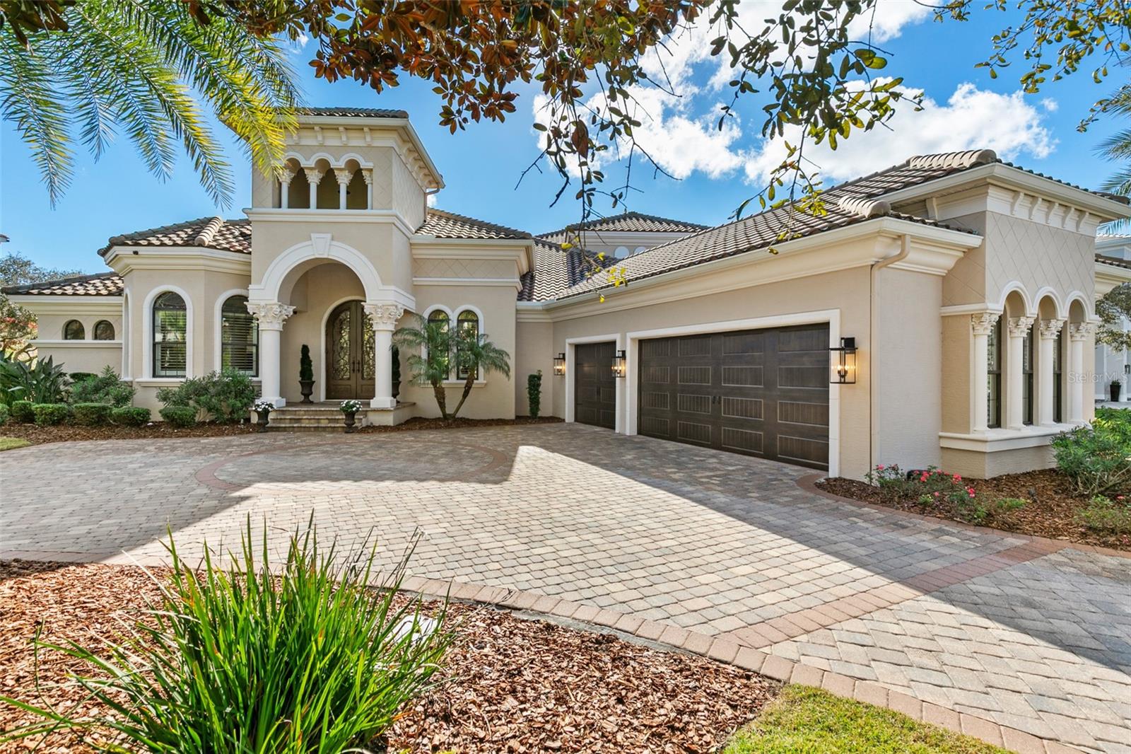 Exceptional coastal residence in the exclusive oceanfront golf community of Hammock Dunes.  Situated on the 18th fairway of the Tom Fazio Links Course featuring breathtaking golf course and ocean views. Designed for effortless indoor-outdoor living, the home features soaring ceilings, elegant architectural details, and expansive gathering spaces ideal for entertaining. The open-concept great room showcases a fireplace with custom built-ins and fully retractable doors that open to a covered lanai, seamlessly connecting to the resort-style pool and spa. The gourmet kitchen is appointed with custom cabinetry, quartzite countertops, stainless steel appliances, a large center island, and adjacent dining areas. The primary suite provides a private retreat with tray ceiling, serene views, and a well-appointed bath, while additional guest suites offer comfort and privacy. A spacious upper-level bonus living area with wet bar creates an ideal space for entertaining or guests. Outdoor amenities include a summer kitchen with fireplace, covered seating areas, manicured landscaping, and a private pool and spa overlooking the 18th fairway, creating a true coastal luxury lifestyle just moments from the beach, golf, and Hammock Dunes amenities. To further elevate the Hammock Dunes Lifestyle, membership to the Hammock Dunes Club is available offering a superior member experience. Featuring an oceanfront clubhouse as well as a "Low Country" clubhouse with formal and casual dining options, 2 Audobon-certified golf courses by legendary designers Tom Fazio and Rees Jones, a 5000sft ocean view fitness center, Oceanfront pool complex, playground, splash pad, tennis courts, pickleball, croquet, bocce and more.