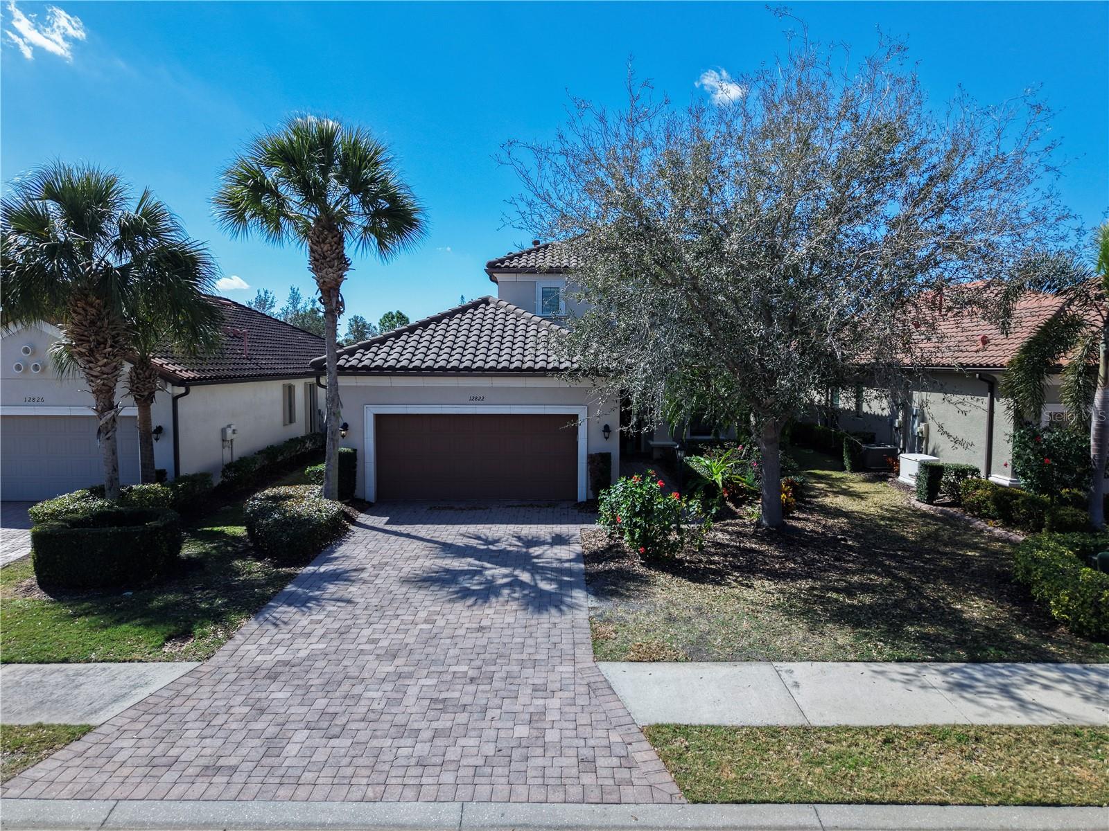 Short Sale. This beautifully updated 4-bedroom, 4.5-bath home in the Esplanade community in Bradenton is priced to sell and offers a thoughtful layout designed for both comfort and everyday living. With generous gathering spaces on both levels, the home features a spacious main living area downstairs along with an additional upstairs area that’s perfect for a media space, game room, or secondary lounge, giving everyone room to relax and unwind. Each bedroom includes its own private bathroom, creating privacy and convenience for family and guests. The open-concept kitchen serves as the heart of the home, flowing seamlessly into the main living area and showcasing an oversized island, walk-in pantry, stainless steel appliances, and abundant cabinetry. High ceilings and large windows fill the home with natural light, enhancing its bright and welcoming feel. The spacious laundry room offers extensive cabinet storage and workspace, adding both functionality and organization. An extended screened lanai creates a comfortable outdoor retreat, ideal for entertaining or enjoying quiet evenings. Located within a gated, well-maintained neighborhood, Esplanade offers resort-style amenities including a community restaurant, golf course, pickleball and tennis courts, fitness center, pool, country club, and much more. The home is just a 20-minute drive to University Town Center and Waterside Place in Lakewood Ranch, which are known for their shopping, dining, parks, events, and lively atmosphere. This home combines space, convenience, and lifestyle in one exceptional location.