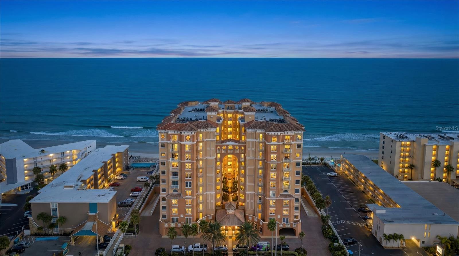 Located in one of Daytona Beach Shores’ most sought after oceanfront towers, this beautifully designed three-bedroom, three-bath residence at Palma Bella delivers luxury, space, and sweeping coastal views in every direction. Perched on the tenth floor, this corner unit captures both the Atlantic Ocean and the Intracoastal Waterway, creating a rare dual-water panorama.

Step through the elegant grand foyer into a refined interior where wide open living spaces and interior hallways provide a true private-residence feel. The heart of the home is a chef’s dream kitchen, designed with abundant counter space, a flat cooktop, generous cabinetry, and seamless flow into the main living and dining areas—perfect for entertaining while enjoying endless ocean views.

From virtually every corner of the home, glass frames breathtaking Atlantic vistas. The expansive corner terrace extends your living space outdoors and features a built-in grill and wine refrigerator, making it ideal for hosting sunset dinners, enjoying sea breezes, or watching the waves roll in below.

This residence features two luxurious ocean-view primary suites, each offering peaceful retreats with spa-style en suite bathrooms. The main primary bathroom includes dual vanities, a walk-in shower, and a large soaking tub, creating a true spa-inspired experience. A third bedroom and full guest bath provide flexibility for guests, family, or a private office.

Additional highlights include a large interior laundry room with washer and dryer, assigned storage space, and the rare convenience of elevators located just steps from your front door. Palma Bella offers resort-style amenities including a beachfront pool and spa, along with a pet-friendly policy allowing two pets up to sixty pounds each.

Built in 2007, Palma Bella remains one of the premier luxury oceanfront communities in Daytona Beach Shores, known for its privacy, elegance, and prime beachfront location.
