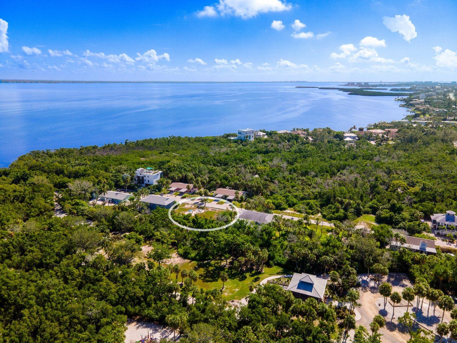 Tucked along one of Longboat Key’s most peaceful and naturally beautiful streets is 681 Gulf Bay Road, a 9,000-square-foot homesite. Positioned just moments from Sarasota Bay and the Gulf of Mexico, this prime island lot offers the rare opportunity to design and build a custom coastal home in a location where nature, privacy, and convenience coexist effortlessly. Set on a quiet residential street bordered by the 32-acre Joan M. Durante Park, this property offers immediate access to shaded walking trails, mangrove boardwalks, bayfront docks, and daily wildlife sightings. With deeded access to both the beach and the bay, you are within easy reach of Longboat Key’s white sand beaches and tranquil bay waters. At the entrance to the street, iconic island favorites like Euphemia Haye and The Haye Loft make impromptu dinners and sunset cocktails delightfully effortless. The lot provides flexibility for a thoughtfully designed primary residence or second home, with space for elevated construction, a private pool, outdoor entertaining areas, and lush tropical landscaping. Located between Anna Maria Island and St. Armands Circle, you’ll enjoy the perfect balance of quiet island living and access to shopping, dining, boating, and cultural attractions in Sarasota.