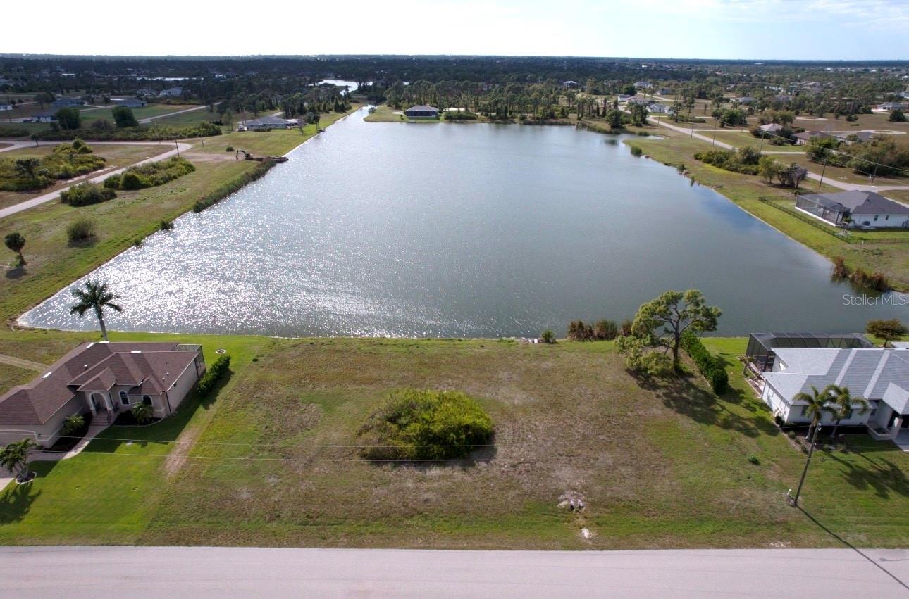 Rare opportunity to own a 0.38-acre double lot with breathtaking western exposure over one of the community’s largest lakes. Nestled in Rotonda Sands, you’re perfectly positioned just 4.4 miles from the Boca Grande Causeway and 4.1 miles to Publix.