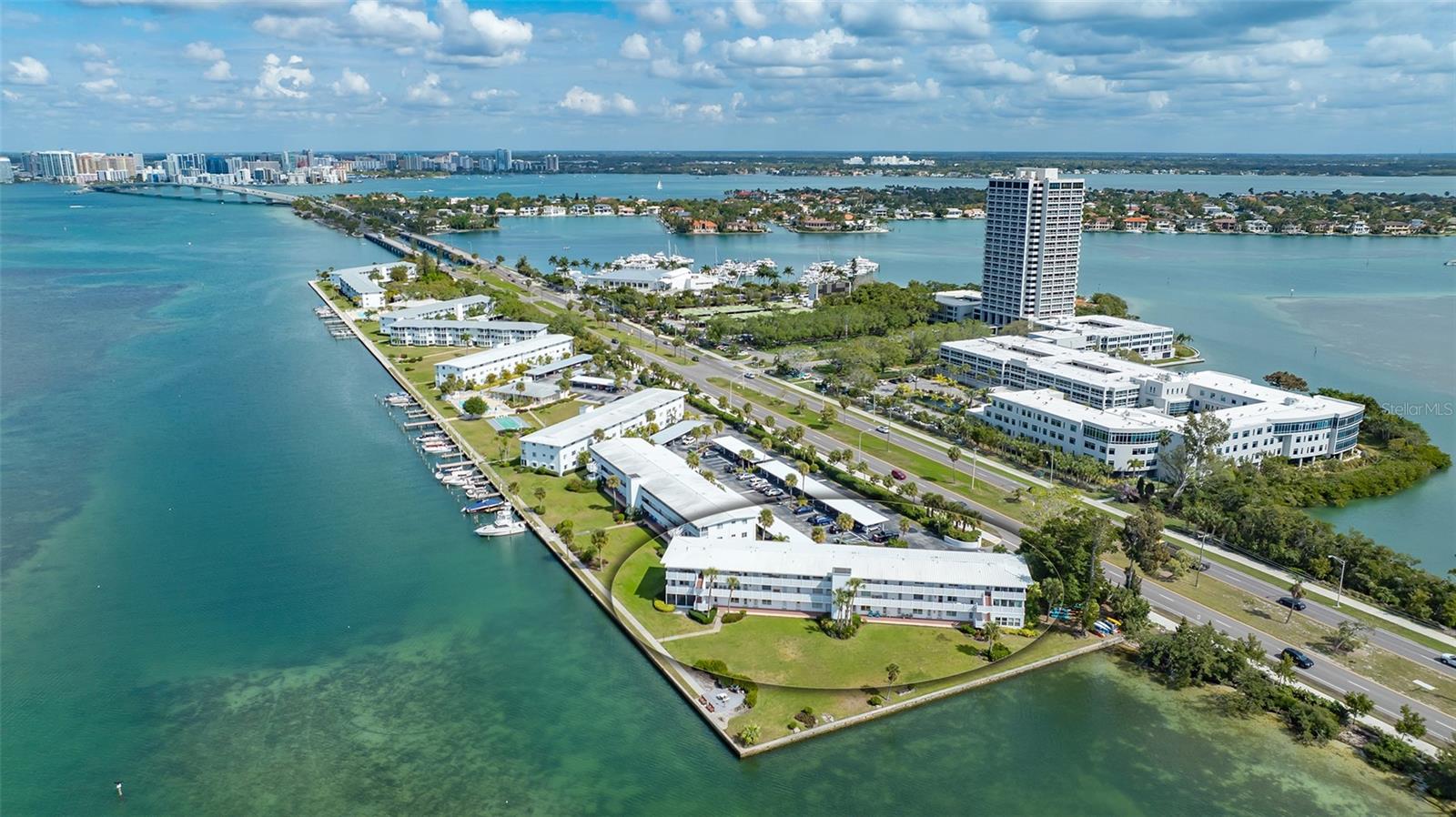 Beautiful views of Sarasota Bay await you from this 2-bedroom, 1-bath, first-floor condo. Newer high impact windows installed 2016, and exterior doors being replaced by association.  Sarasota Harbor is a maintenance-free, 55+ community. Enjoy watching manatees and dolphins from the condo. This unit has the ultimate waterfront lifestyle that offers a leisurely walking path along the seawall, a fishing pier, swimming pool, community room, and more. Launch your kayak onto Sarasota Bay or take advantage of the available boat docks ($1,200 a year)34ft.maximum length. Perfectly positioned between the world-class destinations of St. Armand’s Circle and downtown Sarasota, you can enjoy the five-minute walk to the boutiques and restaurants that line St. Armand’s Circle or the vibrant arts, culture, shopping, and dining of downtown Sarasota across the iconic Ringling Bridge. 
***Boat slips, sidewalks, and carports recently damaged from the hurricanes.  Boatslips/docks currently being replaced.