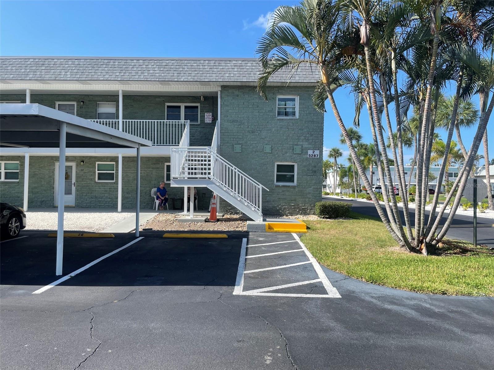 Looking to Downsize or a Winter Retreat?  Come check out this spacious, ground floor, corner unit.  You will love the spacious open feel.  Walk in and the kitchen is to the right and bedroom and bath is to the left.  Bedroom is spacious with a large closet.  Living room/dining room are huge and there is a door that opens up to a little patio.  Master suite is very large with a walk-in closet and your own bathroom with large shower.  Laundry room is located on the 1st floor in the building so no steps.  This is a great community with tons of activities and is centrally located so you are minutes away from the beach.