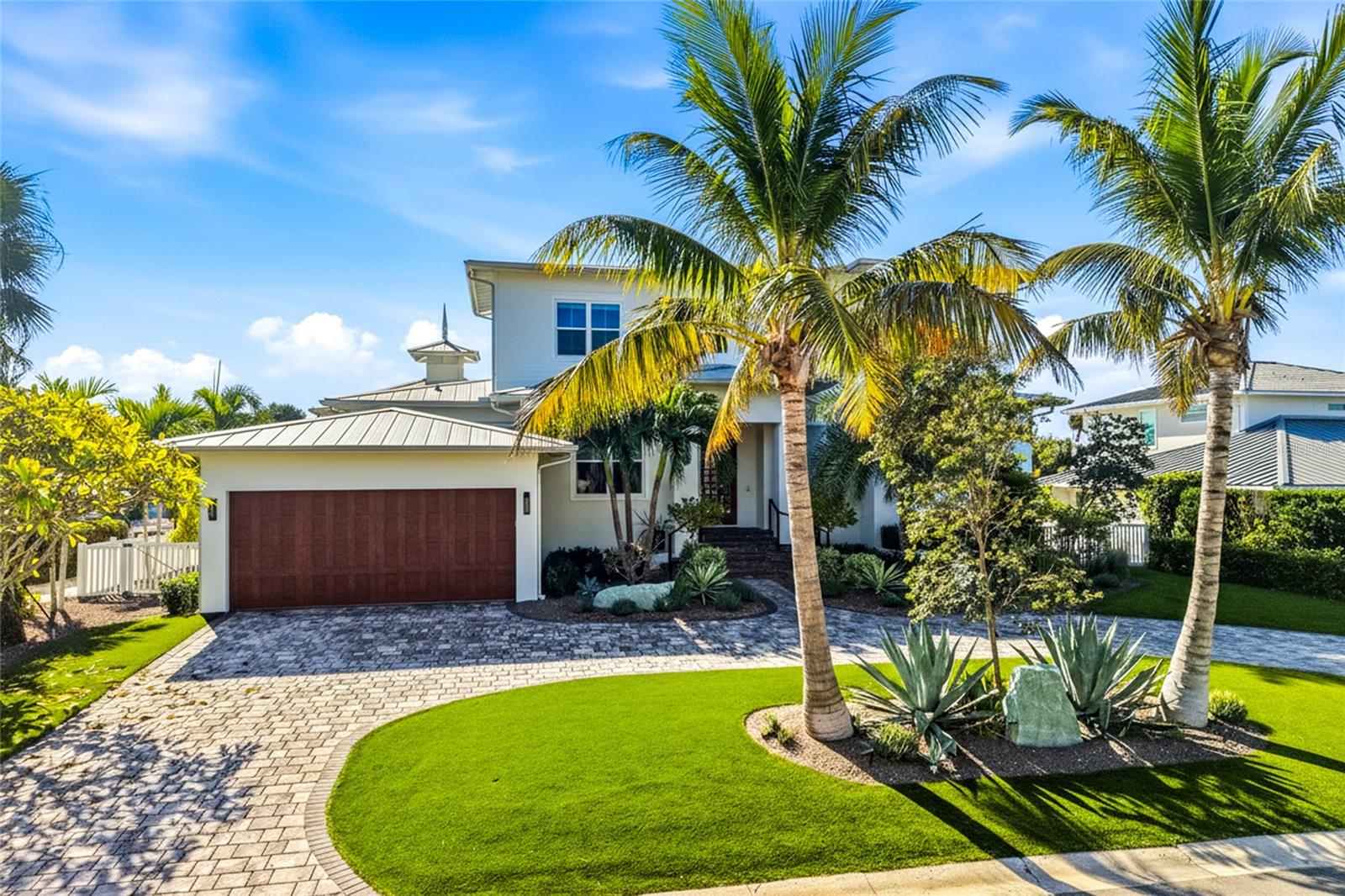 Waterfront Luxury Awaits YOU!  Experience the ultimate Anna Maria Island lifestyle in this stunning custom-built, canal-front residence, perfectly positioned on a quiet street in Key Royale of Holmes Beach. Built with impeccable craftsmanship and thoughtful design, this exceptional 4-bedroom, 5-bathroom home delivers coastal elegance and resort-style living just steps from the sugar-white sands of the Gulf of Mexico.  Step inside to soaring ceilings, an abundance of natural light, and high-end finishes throughout. The open-concept great room flows seamlessly to the outdoor living spaces which includes an outdoor kitchen with a green egg and dining.  Convenient full pool bath and 2 laundry rooms to note! A true standout feature is the temperature-controlled 500+ bottle wine cellar – an exquisite touch for the discerning collector.  The gourmet kitchen is a chef’s dream, featuring premium appliances like Wolf induction cooktop, custom cabinetry, and a large center island that overlooks the canal, dual dishwashers, and a walk-in pantry.   Each of the four spacious bedrooms offers privacy and comfort, with luxurious en-suite bathrooms and generous closet space.  Outside, paradise unfolds: a heated pool and spa invite year-round relaxation, while the expansive covered lanai and low-maintenance artificial turf create a lush, private oasis. Boaters will love the private dock with 16,000 lb boat lift and direct access to Tampa Bay and the Gulf – no bridges, quick out to open water.
Additional highlights include are wet bar with mini fridge for effortless entertaining, Whole-home generator for complete peace of mind, Two-car garage with epoxy flooring, Elevated construction and impact-resistant windows/doors, extra storage room, and a huge outdoor shower.  This is more than a home – it’s a lifestyle. Properties with this combination of luxury finishes, waterfront access, and thoughtful design rarely come available. Schedule your private showing today!