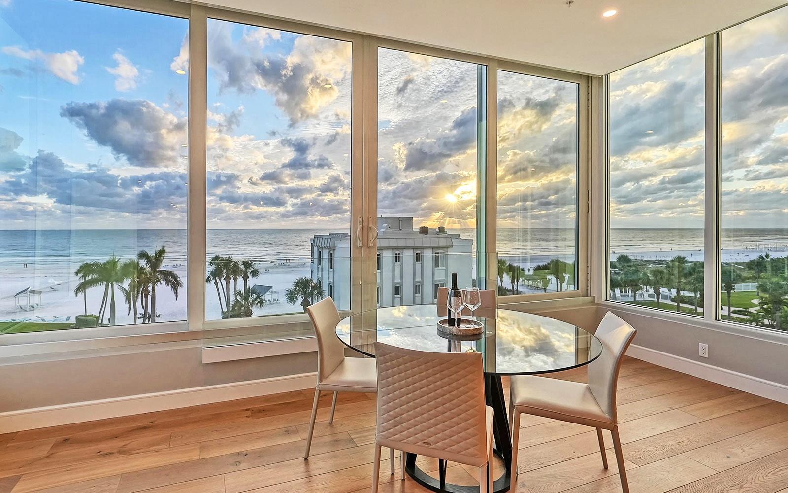One-of-a-kind Siesta Key Beach penthouse with views of all Siesta Beach, from Point of Rocks to Big Pass, and year-round spectacular sunsets. Measuring a whopping 5,764 sq. ft. of living space, this two-story residence is the largest private condominium on Siesta Key. Hearsay has it that the rock group ABBA stayed here while on holidays in Sarasota. This glowing beacon received an extreme glow-up in 2018, an exquisite collaboration by local artisans Clifford Scholz Architects, Jackson & Associates Construction and Studio Santa Maria. The interior was stripped to the walls and completely re-built. Everything is new: electric, plumbing, HVAC, recirculating hot water, impact glass throughout with motorized shades, wide-plank solid oak flooring, designer tile, solid-wood cabinetry, solid-core doors, LED lighting, whole-house Lutron automated lighting, whole-house Sonos sound system, motorized foyer chandelier and automated on/off closet lights. The two-car garage also received a make-over with speckled epoxy floor, spray-foam insulation, split A/C and dehumidifier. The dramatic two-story foyer announces the grandeur within. At the heart of the home is the open-concept living area consisting of kitchen, dining room, great room and sunroom with wrap-around floor-to-ceiling windows. The well-equipped kitchen has SubZero refrigerator, freezer drawer and wine storage; Wolf induction range and chimney hood; Fisher & Paykel double dishwasher drawers; five-foot “The Galley” WashStation with two disposals; wet bar; and concealed walk-in pantry. The main level also has four bedroom suites, TV room and laundry. Upstairs, the all-inclusive master retreat includes the bedroom, walk-in closet, bath, morning bar and office. The massive 700-sq. ft. bedroom has wrap-around windows with the best views of the house. The closet has a center-island dresser, inside closet with Liberty safe and tiled laundry station with drain and curb. The bath has free-standing bathtub with jetted-air full-body massage and double walk-in shower. The office has coffered ceiling and built-in storage. This level also has a 175-sq. ft. storage room. Located on the largest span of private beach on Siesta Key, Island House Beach Resort amenities include a heated swimming pool, community house and beach-side courtyard.