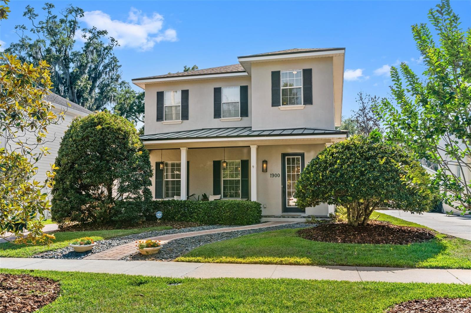 Nestled on one of the most coveted tree-lined streets in College Park's Lake Ivanhoe District, this beautifully updated residence offers the perfect blend of timeless character and modern luxury. Just moments from Lake Ivanhoe and the shops and restaurants of Edgewater Drive, the home delivers an exceptional lifestyle in one of Orlando's most desirable neighborhoods.

Inside, white oak flooring guides you through an elegant formal dining room and into a stunning open-concept living space designed for both everyday living and entertaining. At the heart of the home is a fully reimagined chef's kitchen featuring custom cabinetry, premium finishes, a wine refrigerator, and top-of-the-line Thermador appliances. A striking gas fireplace, custom ironwork, and thoughtfully curated details throughout create a level of craftsmanship rarely found.

The versatile floor plan offers three spacious bedrooms upstairs, along with a flexible bonus space that is ideal for a home office, study area, or fitness room. A private first-floor guest suite provides the perfect retreat for visitors or multigenerational living.

Significant recent improvements add both value and peace of mind, including a newly installed roof and a newly constructed saltwater pool. Outside, lush landscaping surrounds the backyard, creating a private oasis perfect for relaxing or entertaining. 

Ideally positioned near Princeton Elementary, Park Avenue, AdventHealth, Orlando Health, and Downtown Orlando, this home places the very best of Central Florida at your doorstep. Opportunities to own a turnkey property in this premier College Park location are few and far between.