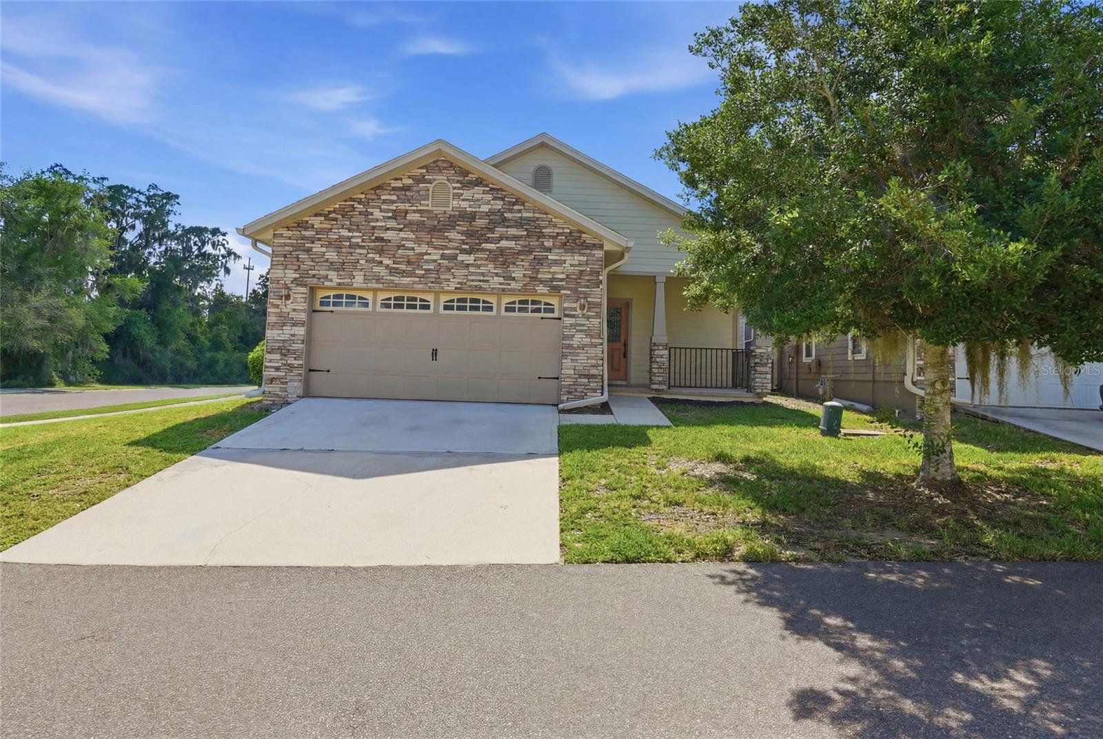 Turnkey three bedroom home in the desirable community of South Pointe! The stone on the front of the house gives it a great custom feel. As you enter the home, the large kitchen with matching white appliances and breakfast bar opens in front of you. The open floor plan flows into the large living room, making it perfect for entertaining. The interior walls are freshly painted and give off a a bright and airy touch. Just off of the living room is the primary suite that has a spacious walk-in closet. The primary bathroom has a double vanity, garden tub and walk in tiled shower.  There are two additional bedrooms and hall bath located in the back of the home. There is a large two car garage with washer/dryer hookups and an electronic door opener.
The roof, siding and lawn maintenance are covered by the HOA to give you extra peace of mind. The community has a sparkling pool, perfect to escape the summer heat. Just minutes from the shopping and restaurants in Town of Tioga. Schedule your showing today!