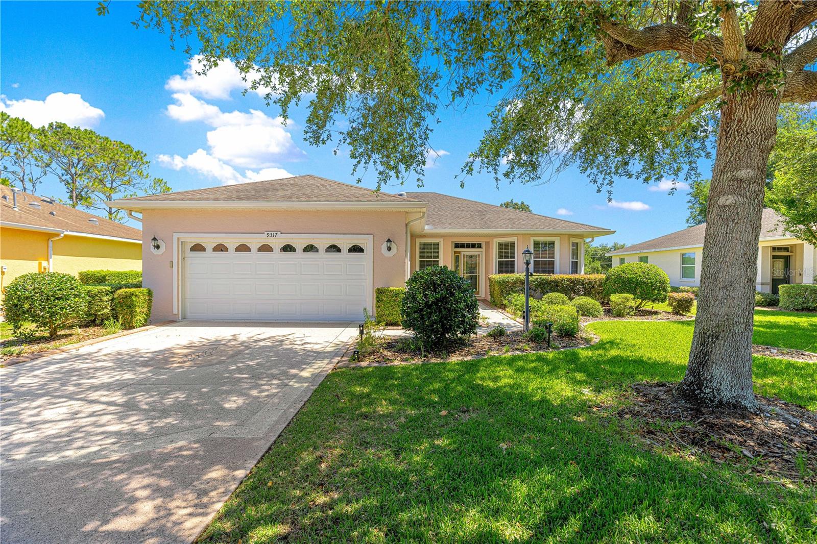 One or more photo(s) has been virtually staged. This 3 bedroom, 2 bath, 2 car garage home is located in the much sought after 55+ community of On Top of the World. The Kingston model is located on a private golf course lot. You will immediately notice the custom stamped epoxy drive and walkway. Upon entering there is neutral tile in the kitchen, dining and living areas. The kitchen also features granite counter tops. Stainless steel appliances and wood cabinets. LVP in the primary and second bedroom. Carpet in the third bedroom. The primary bath has a step in shower, tile flooring and a double sink vanity. The guest bath has a tub/shower combo. Slider off the living room leads to a screened lanai with beautiful, private views of the golf course. Laundry room with storage and a 2 car garage. Furniture stays with the home. Don't wait to call for your appointment to view today!