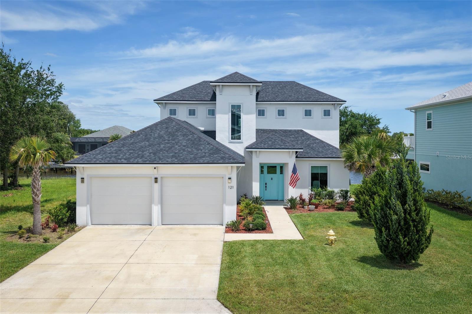 Experience coastal luxury in the highly sought-after Seaside Landings community, one of Flagler Beach's newest gated waterfront neighborhoods. Custom built by Intracoastal Builders in 2023, this stunning two-story concrete block home offers exceptional craftsmanship, modern design, and direct saltwater canal access for the ultimate Florida lifestyle. Both stories are concrete. 
Designed with comfort and flexibility in mind, the home features three private en-suite bedrooms, each with its own walk-in shower. The first floor includes a spacious en-suite that can easily serve as a primary suite, guest retreat, or multigenerational living space. Luxury vinyl plank flooring flows throughout the home, complementing the bright open-concept floor plan. A dedicated office/den provides the perfect space for working from home, while the gourmet kitchen is beautifully appointed with granite countertops, designer tile backsplash, pantry, flat-top range, microwave/oven combination, and a charming breakfast nook overlooking the water.
The spacious great room is the heart of the home, featuring sliding glass doors that open to a covered and screened lanai where breathtaking waterfront views become part of everyday living. Step outside and enjoy your private backyard paradise complete with a 36' x 16' dock, electric service, 10,000-pound boat lift, and a seawall completed in 2023. Whether you're heading out for a day on the water or simply relaxing by the canal, this property offers endless opportunities to enjoy coastal living.
Upstairs, you'll find a versatile loft/living room area featuring a built-in 4.5' x 8' safe, along with the primary suite and third en-suite bedroom. The luxurious primary retreat boasts a spacious walk-in closet, dual vanity, soaking tub, and an oversized walk-in shower, creating a true spa-like experience.
Additional features include an inside laundry room, two-car garage with storage above, and modern construction that provides peace of mind for years to come. From watching dolphins play and manatees glide through the canal to enjoying easy boating access right from your backyard, this exceptional waterfront home offers a rare opportunity to embrace the best of Flagler Beach living in a premier gated community. Don't miss your chance to own a slice of paradise where luxury, comfort, and waterfront adventure come together.
