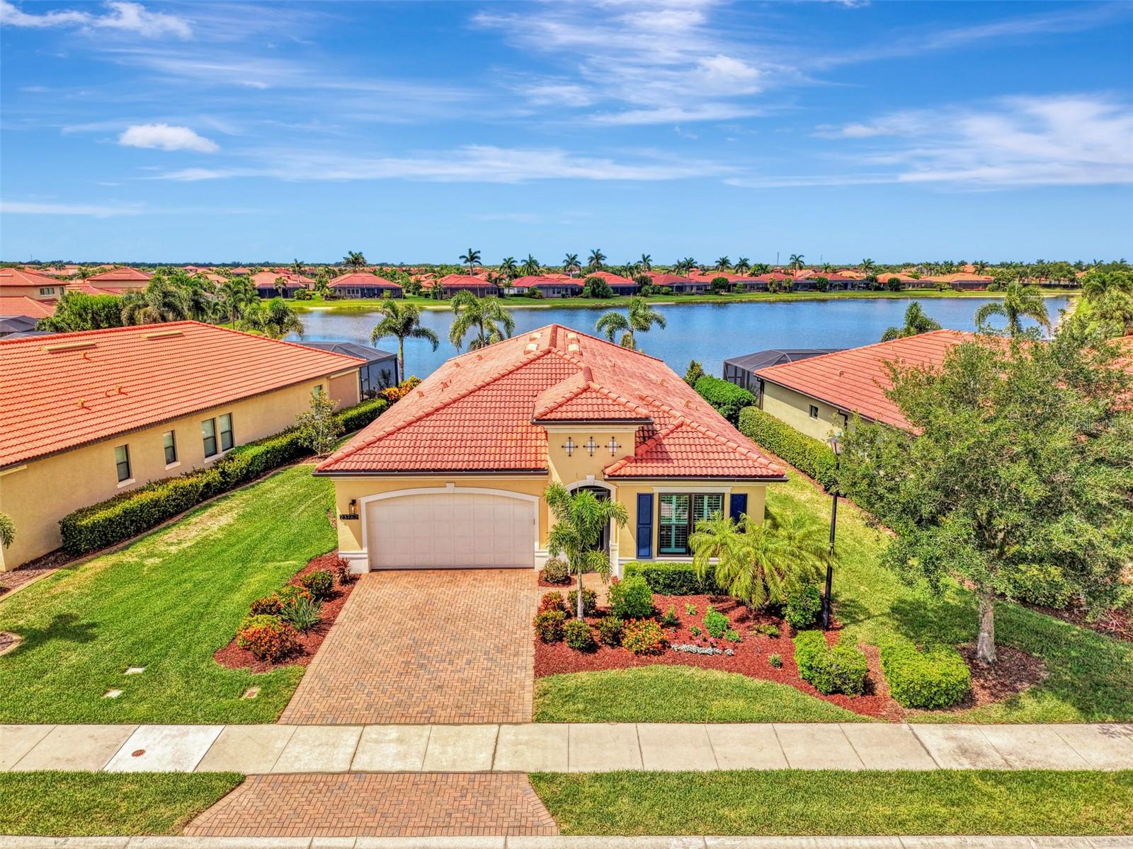 Own this stunningly renovated WCI built Key Largo model located in the highly sought after gated community of Sarasota National. One of the most desirable floor plans, the Key Largo features 3 en suite bedrooms, a 4th bedroom that easily works as an office/den, and an open concept floor plan designed for entertaining. Two deeded golf memberships included. Enjoy a tropical oasis with Southwest facing water views, a sparkling pool with new heater (2024), screen enclosure with clear view screens on all sides, decorative tile lanai walls, and a custom installed outdoor kitchen with vented hood and refrigerator (2024). The owners spent the last 4 years completely renovating this home, including brand new hurricane impact windows (2024). Storm prep is a breeze with an automated hurricane shutter that secures the lanai at the push of a button. On the inside, builder tile was removed, and luxury vinyl plank flooring was installed throughout, making this home carpet free! Other upgrades include new crown moldings, fresh interior and exterior paint, a new front door, designer light fixtures and fans, plantation shutters, and so much more! The kitchen cabinets feature dovetail constructed drawers and were recently professionally painted. The kitchen also features soft close doors and drawers, new champagne hardware, a luxury quartz countertop, large single bowl sink, upgraded fixtures, and new microwave (2026). The expansive living room has a decorative wood accent wall, tray ceiling, and a wall of sliders that leads to the lanai, and the light filled dining area easily accommodates guests. The primary suite has water views and a decorative accent wall, and the primary bathroom has dual sink vanity upgraded with quartzite counters, new fixtures, new LED mirrors, a walk-in shower, private water closet, and a large walk-in closet with custom built-ins. Two additional bedrooms are private suites with en suite bathrooms, both of which showcase new quartzite counters, and the 4th bedroom easily acts as a den/office with glass French doors. Just off the foyer you will find a butler’s pantry, a renovated half bathroom, additional closets, and an upgraded laundry room with utility sink and new washer and dryer (2026). New hot water heater (2024). The golf course is currently receiving a 5-star renovation, and this owner has already paid the renovation assessment in FULL. Sarasota National is a maintenance free community that includes irrigation, mowing, trimming, edging, fertilization, re-mulching, cable, guard gate, resort style amenities, championship golf course, and so much more! Live like you are on a 5-star vacation with a 30,000sf clubhouse with resort pool, hot tub, outdoor tiki bar serving food and drinks daily, coffee house, 3 dining options, 7,000sf fitness center with top-of-the-line equipment and classes, card room, bocce ball, pickle ball, tennis, dog park, playground, and event lawn! Sarasota National is a coveted 2400-acre International Audubon Bird Sanctuary that offers some of the most beautiful water and preserve views in all of Venice. This home is minutes from the new and exciting town center of Wellen Park and the Atlanta Brave's spring training camp at the CoolToday Park Stadium. Explore 3 local beaches and historic downtown Venice, all just a short drive from your front door! If you have dreamed of owning a piece of Florida's paradise, look no further than Sarasota National... one of Venice's premiere golf communities!