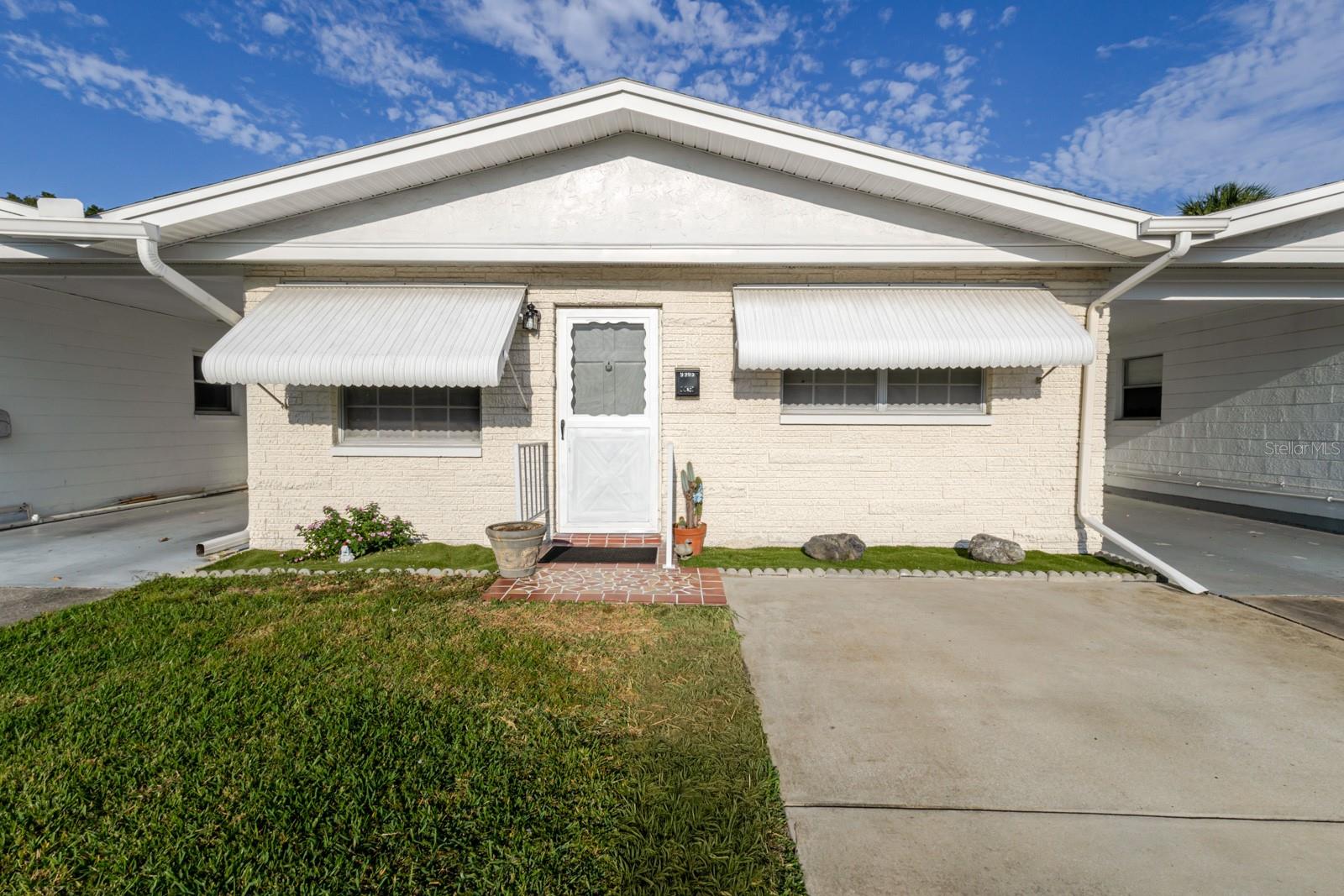 One or more photo(s) has been virtually staged. Welcome to Springwood Villas I, a highly sought-after 55+ community in central Pinellas Park offering maintenance-free living with exceptional amenities and convenience! This single-story villa features 2 bedrooms and 1 bathroom, tastefully updated for comfort and style. The kitchen has been beautifully renovated with white shaker cabinetry, granite countertops, stainless steel appliances, and gas cooking—a rare find in Florida. The bathroom features updated tile flooring and a stylish tub surround.

Enjoy a spacious living and dining area with warm wood-look laminate flooring, while both bedrooms include ceiling fans, new carpeting, and upgraded doors for a fresh, modern touch. The large primary bedroom easily accommodates a king-size bed, offering generous closet space and natural light. The enclosed Florida room provides a perfect bonus space for relaxing, hobbies, or entertaining, complete with an additional storage closet. Just outside your door, you’ll find your private driveway for easy parking and access.

The community is exceptionally well-maintained and known for its friendly, active lifestyle. Residents enjoy a heated pool, shuffleboard courts, a clubhouse, and on-site laundry facilities, along with a full calendar of social activities—including cornhole, game nights, and community gatherings that make Springwood Villas feel like home.

Centrally located in Pinellas County, this villa offers easy access to U.S. 19 and 49th Street N, placing you minutes from shopping, dining, and everyday conveniences—Publix, Target, and Walmart are less than 2 miles away. The location also offers quick routes to the Gulf beaches, downtown St. Petersburg, and Tampa Bay attractions, making it an ideal home for snowbirds, retirees, or year-round residents seeking value and convenience.

The low monthly HOA covers water, sewer, trash, cable, internet, and natural gas (used for cooking, heat, and hot water)—leaving only your electric bill! Experience affordable, carefree Florida living in one of Pinellas Park’s most established and welcoming 55+ communities.

Come see why so many love calling Springwood Villas home!