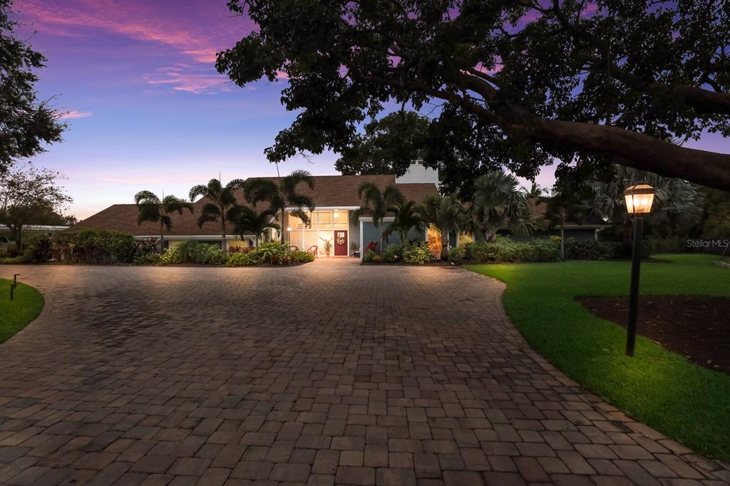 INCREDIBLE RENOVATED 4 BEDROOM, OFFICE, 3.5 BATH ESTATE ON RIVERVIEW BLVD ON OVER ONE ACRE!!! Through the private, gated driveway you will find this absolutely stunning WARNER'S EAST BAYOU WATERFRONT property, sitting at 4,268 square feet, with direct access to the Manatee River and the Gulf of Mexico, and offers many amazing upgrades & features! This one-acre lot is completely surrounded by shady trees and lush landscaping with 290 feet of water frontage which is truly a boater's dream! THE UPGRADE LIST GOES ON; IMPACT WINDOWS & DOORS,HALO 5 WHOLE HOUSE WATER FILTRATION SYSTEM, NEW LANDSCAPE & LANDSCAPE LIGHTING, UPGRADED IRRIGATION SYSTEM, GUTTERS WITH LEAF GUARDS, SALT WALTER POOL WITH ATTACHED SPA, BRAND NEW MASTER BATHROOM & SECOND BATHROOM, NEW HALF BATH ADDED,NEW LIGHT FIXTURES,UPDATED ELECTRICAL PANEL ON BY DOCK, IMIST SYSTEM, NEW EXTERIOR HARDIE SIDING, NEW DUCTWORK, NEW CUSTOM FIBERGLASS FRONT DOOR, LED RECESSED LIGHTING, CUSTOM PANTRY ADDED, MOTORIZED BLINDS,LUXURY VINYL FLOORING,UPGRADED KITCHEN,OUTDOOR KITCHEN ADDED, FIREPIT, NEW INTERIOR DOORS, CARPORT, POOL SHED, FRENCH DRAINS, NEW GATES & MOTORS, EPOXY GARAGE FLOOR, GARAGE STORAGE & THE LIST GOES ON & ON. THE SELLERS SPARED NO EXPENSE WHEN RENOVATING THIS HOME! NOTHING LEFT TO DO BUT MOVE IN!!  Inside you will notice the soaring high ceilings and the beautiful wrap-around staircase which greets you as you come in. Around the corner, you will find a formal living room with a tall brick, dual-facing fireplace and new luxury vinyl flooring. Adjacent to the living area is a spacious designated dining room leading to the gourmet eat-in kitchen which features recently painted shaker-style cabinets, subway tile backsplash, quartz countertops, stainless steel bosch appliances, matte fixtures, an oversized island with seating and the most incredible extra wide window with an immaculate view of the water! There is a convenient bedroom and bathroom downstairs which would be the prime spot to house sleepover guests with three more upstairs. The master suite is straight from a dream, with its own balcony looking out to the bayou. Additional features are a cozy brick fireplace, a wall-to-wall walk-in closet with bonus storage & built-ins, & an attached recently renovated en-suite bath that offers his & her sinks, a stand-alone shower, a relaxing garden style tub, & the best part being your own personal SAUNA. This luxurious portion of the house will be a private oasis where you can retreat to after long days on the water! There is a bonus family room on your way out to the patio and would be a grand gathering area for all future holidays!Step outside to the brick-paved, covered patio looking over your sparkling salt walter heated pool and spa, a FULL sized outdoor kitchen with coyote grill, high end smoker & pizza oven, bar-style seating, multiple spots for dining, and plenty of fun in the sun! There is an expansive boat dock with water & electric connections, and the 12,000 lb boat lift gives you easy access to daily boating & rides out to the Gulf. Warner’s East Bayou is perfect for as much boating, fishing, skiing, kayaking, & paddleboarding as you could want! This home is designed with entertaining in mind and finely detailed to include everything you need! Centrally located, just 9 miles from sandy beaches & minutes from shopping, dining, & too many outdoor activities to name! Come & see this once-in-a-lifetime property before it is gone, call to schedule a tour today!
