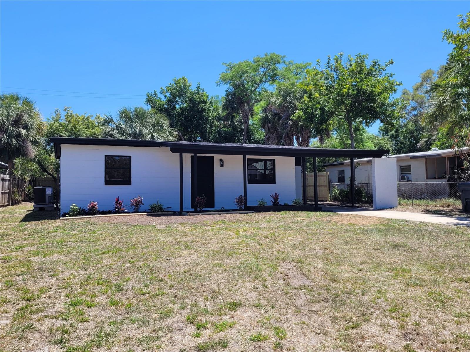 This beautifully revitalized home blends classic charm with modern comfort, offering a fully updated interior from top to bottom. The two-bedroom, one-bath layout features brand-new flooring, fresh light fixtures, and stylish new cabinets that elevate every room. The kitchen shines with gorgeous granite countertops, a new refrigerator, and a complete suite of modern appliances. Comfort comes easy with a brand-new air conditioner, heater, and ceiling fans in each bedroom. Step outside to a serene, fenced-in backyard adorned with lovely mature trees — a perfect private retreat for relaxing or entertaining. This move-in-ready gem truly feels like a brand-new home wrapped in timeless character.
