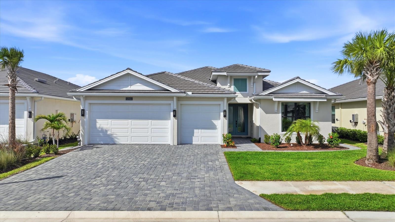 Welcome to an exceptional residence in the highly sought-after community of Solstice at Wellen Park, where luxury, comfort, and thoughtful design come together seamlessly. As you enter through the grand double doors, you are welcomed into an impressive entry hall that immediately sets the tone for the elegance and detail carried throughout the home. This stunning residence offers 4 bedrooms, 3 full baths, and a half bath, along with a spacious 3-car garage, all curated with impeccable attention to detail. From the moment you step inside, you’ll notice elevated 8-foot doors, coffered ceilings, and a refined interior featuring custom wood cabinetry, built-ins, designer wallpaper, and tailored finishes throughout. Designed for both everyday living and elevated entertaining, the home includes a built-in wall unit, in-home theater with surround sound, and a central vacuum system for modern convenience. Each of the four bedrooms features custom-designed closets, while all bathrooms showcase custom mirrors and high-end finishes. Custom blinds and window treatments complete the home with style and sophistication. Step outside to your private retreat—over 1,600 square feet of outdoor living space designed to impress. The heated, saltwater pool takes center stage with a fully equipped outdoor kitchen and expansive entertaining areas. All of this is perfectly positioned to capture a breathtaking pond view, creating a serene and picturesque backdrop. Recent enhancements include new landscaping, upgraded lighting, and an extended walkway, further elevating the home’s curb appeal. For peace of mind, the property is equipped with hurricane shutters, a generator, and a Halo whole-home water filtration system. Every inch of this home has been thoughtfully curated to deliver a true luxury lifestyle. Offered with the possibility of being furnished, this is a rare opportunity to move right into a beautifully completed home without compromise. Living in Solstice at Wellen Park means enjoying resort-style amenities, including a pool, clubhouse, pickleball and tennis courts, fitness center, dog park, and tot lot, everything you need for a vibrant and active lifestyle. Conveniently located and just a golf cart ride to downtown Wellen Park, near local beaches, Venice shopping and dining, Atlanta Braves Spring Training Facility, I-75, and area airports.
Experience refined Florida living at its finest—this is more than a home, it’s a statement.