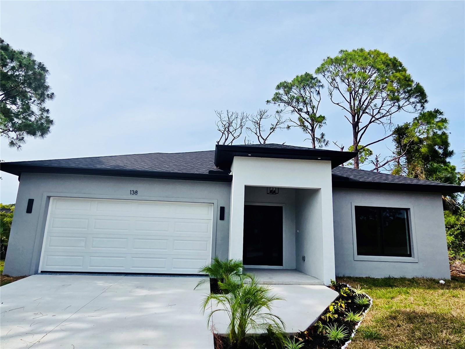 BEAUTIFUL NEW CONSTRUCTION HOME located in the desirable community of Rotonda West, featuring 3 BEDROOMS + DEN AND 2 FULL BATHROOMS. The versatile DEN is perfect for a HOME OFFICE, PLAYROOM, GUEST AREA, OR FLEX SPACE, adapting easily to today’s lifestyle.

This home offers a MODERN OPEN FLOOR PLAN with HIGH CEILINGS, spacious living and dining areas, and a stunning kitchen featuring QUARTZ COUNTERTOPS, SHAKER CABINETS, STAINLESS STEEL APPLIANCES, DESIGNER LIGHTING, AND A LARGE CENTER ISLAND, ideal for entertaining and everyday living.

The PRIMARY SUITE includes DUAL VANITIES, ELEGANT FIXTURES, AND AN OVERSIZED WALK-IN SHOWER WITH FLOOR-TO-CEILING TILE. Additional highlights include **Luxury Vinyl FLOORING THROUGHOUT, MODERN BLACK AND GOLD ACCENTS, AND IMPACT-STYLE WINDOWS AND DOORS.
Conveniently located near golf courses, beaches, marinas, restaurants, and shopping, this home is ideal as a primary residence, vacation property, or investment opportunity. Schedule your showings now.