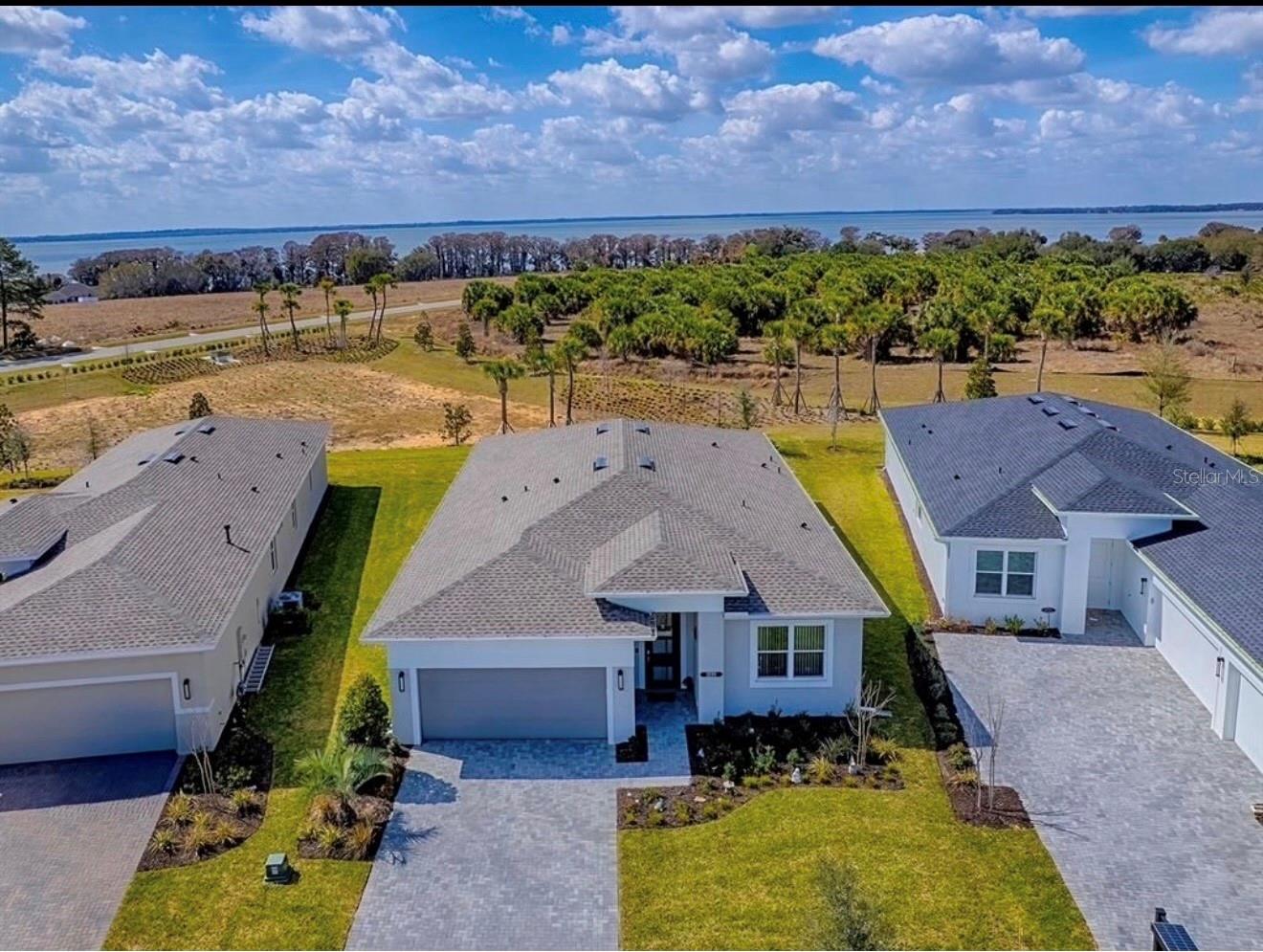 Price to sell!! Why wait 7–9 months for a new build when you can move right in? This beautiful home is ready now and offers a premium location with open space behind you—no rear neighbors and added privacy. Enjoy all the benefits of new construction for less than building - without the wait!

Experience Spectacular Lakeview!

Wake up to tranquil lake views and end each day with breathtaking sunsets from this exceptional new home in the highly sought-after 55+ community of Cresswind at Lake Harris. Perfectly positioned on a premium lot, this home offers stunning views of Lake Harris, enhanced privacy with green space behind the property, and plenty of room to add your dream pool.



Designed with both luxury and comfort in mind, this beautifully upgraded residence features a gourmet kitchen with premium GE appliances, upgraded cabinetry, elegant quartz countertops, luxury vinyl plank flooring throughout, designer lighting, and custom vertical shades. The spacious primary suite boasts a deluxe bathroom with a seamless glass shower, while the extended bathroom layouts provide additional comfort and functionality. Additional upgrades include a tankless water heater, epoxy-coated garage floor, and attractive paver driveway.



One of the home’s most impressive features is the expansive 25’ x 12’ screened lanai with paver flooring and a wind-resistant, nearly invisible panoramic screen enclosure. Enjoy unobstructed views of the serene waters of Lake Harris while relaxing, entertaining, or simply taking in the natural beauty that surrounds you.



The versatile flex room offers endless possibilities as a third bedroom, home office, den, hobby room, or guest space.



Residents of Cresswind at Lake Harris enjoy a true resort-style lifestyle with planned amenities that include:



Eight championship pickleball courts

A grand clubhouse

State-of-the-art fitness center

Resort-style swimming pool overlooking the lake

Walking and nature trails

Docks and boat slips with direct access to Lake Harris



Located in Tavares, known as “America’s Seaplane City,” this vibrant community is just minutes from the charming downtown of Mount Dora, approximately 30 minutes from The Villages, and about an hour from Orlando and its international airport along with parks and attractions.



Outdoor enthusiasts will love exploring the expansive 70,000+ acre Lake Harris Chain of Lakes, famous for world-class freshwater fishing, boating, waterfront dining, and interconnected waterways that stretch across Central Florida.



This is more than a home—it’s a lifestyle. Schedule your private showing today and discover why Cresswind at Lake Harris is one of Central Florida’s most exciting active-adult communities. Your lakefront dream home awaits!