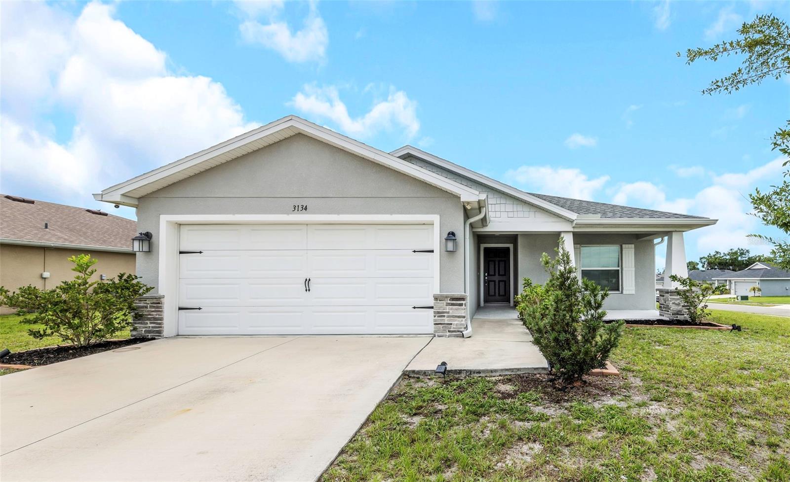 Excellent opportunity to own in Jackson Crossings without waiting for anything to be built. Welcome home to this immaculately maintained 3 bedroom 2 bath 2 car garage built in 2021 on a huge corner lot. Open concept with large kitchen, stainless steel appliances, center island and breakfast bar. This house features luxury vinyl in all area except the bedrooms. The family room/gathering area is perfect for entertaining friends and family. The inside laundry room is under air and does not create the need to go into the garage during the hot summer months. The community features pickleball courts. Excellent location as 275, 75 and 19 are within minutes. Tampa International 40 minutes, Fort Desoto 20-25 minutes, Sarasota 15 minutes and Tropicana Field 25 minutes. Come see this soon!