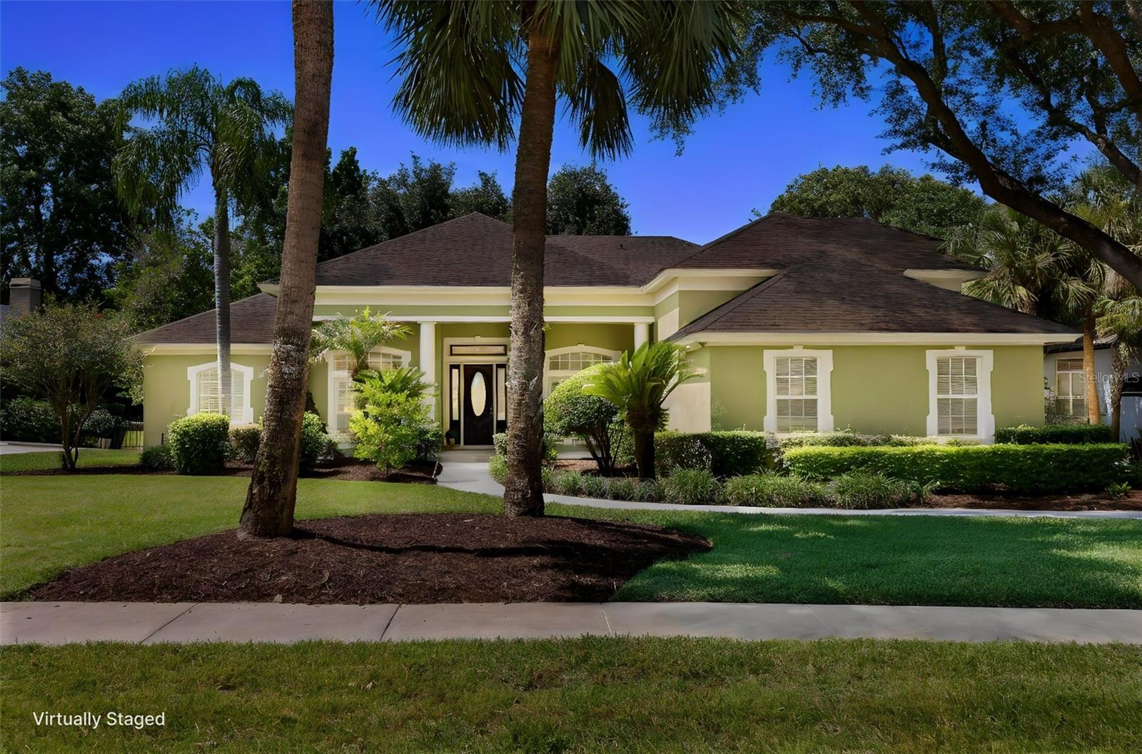 Virtually Staged. Privately set within the exclusive gated community of Tuscawilla Reserve, this stunning custom estate delivers over 4,000 square feet of light-filled, designer-inspired living centered around a spectacular kitchen and family room that truly defines the home. With 5 bedrooms, 5 full baths, plus a private office/bonus room, this residence offers exceptional versatility for today’s lifestyle. Sleek wood flooring flows seamlessly throughout the main living areas, complementing the home’s open, modern design. The impressive kitchen and family room feature soaring two-story ceilings and expansive windows, framing views of the outdoors and pool area while filling the space with natural light—creating an inviting setting for both everyday living and elevated entertaining.The chef’s kitchen is a true centerpiece, anchored by JennAir appliances, including double ovens, convection oven, and microwave combo, along with a massive granite-topped island—all coming together to create a stunning focal point that anchors the kitchen and family room. Custom details further enhance the design, including a built-in buffet with integrated wine refrigerator and an oversized walk-in pantry. The thoughtfully designed floor plan offers incredible flexibility, including an upstairs retreat featuring an additional bedroom, full bath, and expansive flex space that can easily function as a media room, playroom, or second private office.Step outside to your private backyard oasis featuring a sparkling pool and spa with a new heater, surrounded by mature landscaping and a fully fenced yard, offering both openness and privacy. Additional highlights include a 3-car side-entry garage, whole house water softener and expansive living areas that support a variety of lifestyle needs. Ideally located near the Seminole Trail and just minutes from Tuscawilla Country Club, residents enjoy golf, tennis, swimming, and vibrant social amenities. Zoned for highly regarded Seminole County schools, this home offers both lifestyle and long-term value. Golf carts are a popular mode of transportation within the community, adding to the charm and convenience. A seamless blend of modern design, natural light, and elevated living—this is Tuscawilla Reserve at its finest. Schedule your private showing today and experience this exceptional home in person.