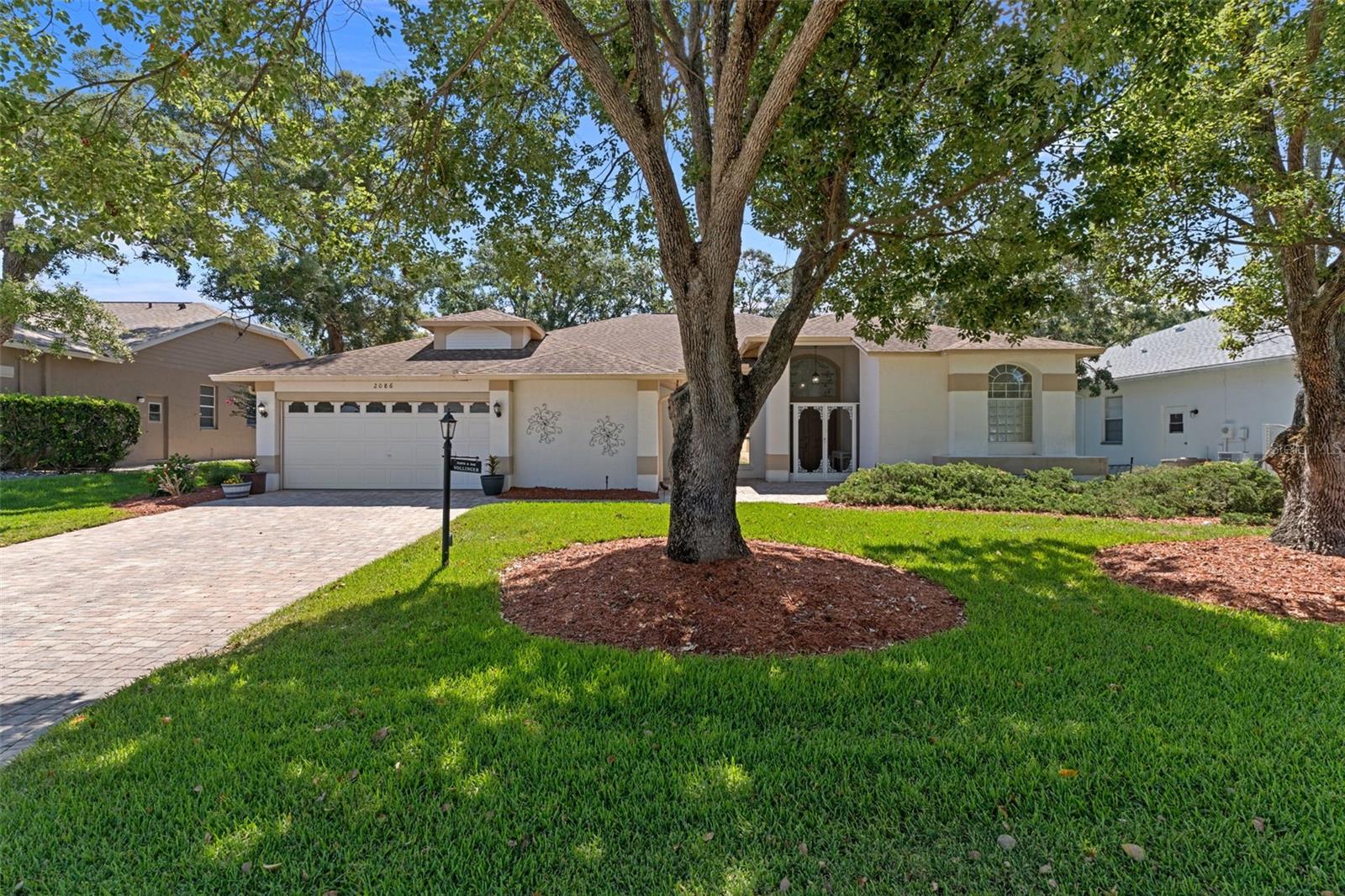 Welcome to this beautifully maintained modified Kent III floorplan offering 2,588 sq. ft. of living area, featuring 4 bedrooms, 2 baths and 2 car garage.  Step inside to discover the 10 ft. ceilings and laminate flooring throughout the main living areas, while tile flooring in the kitchen and baths.  The spacious kitchen has granite countertops and base cabinets with pull-outs.  The large primary suite features two large walk-in closets and an ensuite bath with a jetted tub, granite countertops, linen closet and a comfort height toilet.  One of the 3 bedrooms is ideal for a private office or den.  The guest bath also offers a granite vanity, linen closet, comfort height toilet, and a walk-in shower.  The laundry room includes a laundry tub, pantry, cabinets & shelving for extra storage.  The Lanai is enclosed with acrylic windows, under heat and air with indoor/outdoor carpeting overlooks a beautifully landscaped garden and a private paver patio.  The 2-car garage is equipped with a new service door, hurricane braces on the overhead garage door with an electric screen, and a central vac.  Major updates include a 2019 roof, new HVAC installed in April 2026, Remediated Sinkhole with documentation.  Timber Pines is an award winning, 55+ Active Adult Gated Community with 4 golf courses, 2 pools & hot tubs, Country Club, Restaurant and Lounge, Performing Arts Center, 2 Pro Shops, 12 newer, State-of-the-Art Pickle Ball Courts, Tennis, 2 Dog Parks, and a State-of-the-Art Wellness Center & Fitness Center & over 100 clubs, and activities.