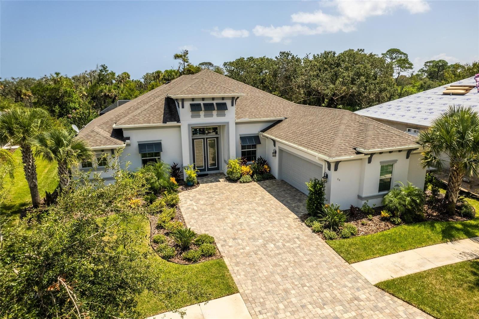 Your dream of owning a stunning home on the Intracoastal in the coveted Grand Haven Community is here. Located on an oversized lot, this beautiful new home has amazing curb appeal with its paver driveway and courtyard style garage. Enter the double door etched glass entry, and you are greeted with a phenomenal view. The great room features oversized porcelain tile and coffered ceilings and is open to the kitchen which is a chef’s delight with 42” cabinets, quartz counters, and a large walk in pantry.

The split floor plan has 2 bedrooms and 2 baths on one side and the Owner’s suite on the other; just perfect to have family or friends visit. The patio and pool area boasts a spectacular summer kitchen with stacked stone detail and the easy to maintain saltwater pool is solar heated. The lovely view is private too! This property shares a common walkway to the ICW and plans for a boat house can be provided. All of this in the fantastic Grand Haven Community with a Nicholas Golf Course, 7 lit tennis courts, pickleball, croquet courts, workout facilities, 2 pools, a dog park, bocce ball, restaurants and walking paths.

Make your appointment to view this property today.


Located in the Grand Haven community with a Nicholas Golf course, 7 lit Tennis courts, pickleball, croquet courts, workout facilities, 2 pools, dog park, bocce ball, resturants and more.  Make an appointment to view this property today.