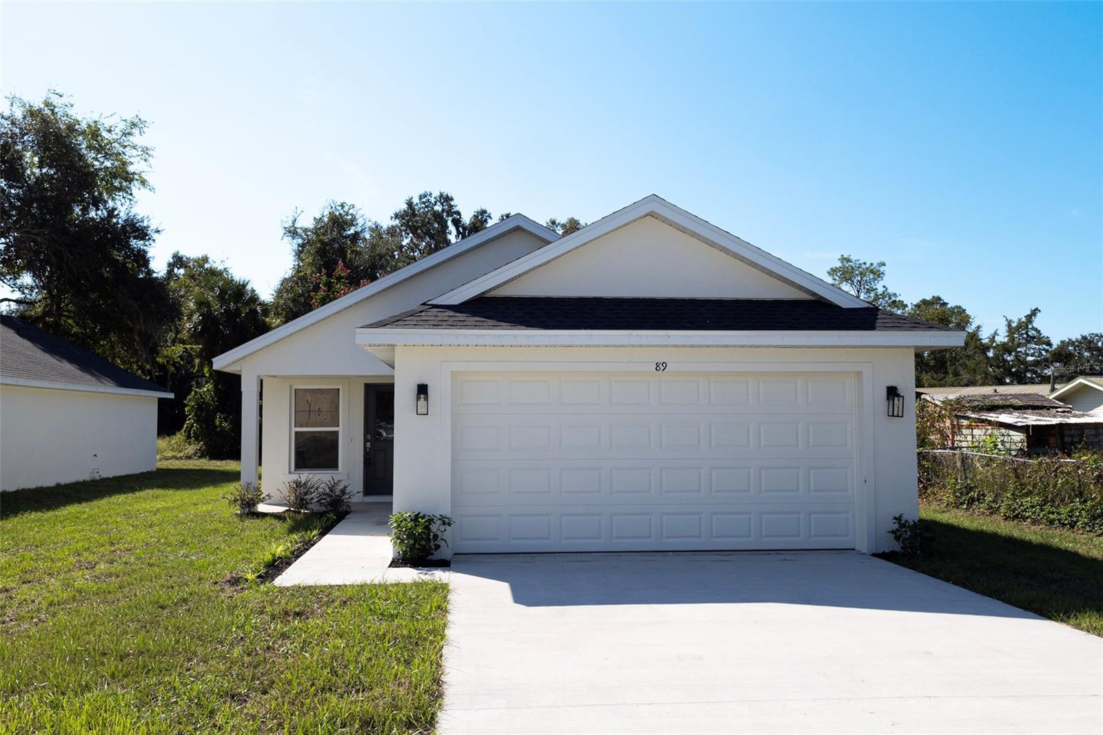 Welcome!
Sitting in the heart of central Florida, this brand-new home is in the charming town of Webster and is waiting for you! This cozy home boasts 3 bedrooms, 2 bathrooms and attached 2 car garage.  The kitchen claims beautiful cabinets and is equipped with STAINLESS STEEL appliances, GRANITE COUNTERTOPS, MOEN PLUMBING FIXTURES, and CERAMIC TILE THROUGHOUT THE MAIN LIVING AREAS. The kitchen boasts ample kitchen cabinet space, making meal prep a breeze. The master bedroom includes an ensuite bathroom offering a peaceful retreat from the rest of the home. The other two bedrooms share a spacious bathroom with granite countertop. The open concept living area is designed with both entertaining and relaxation in mind. The living room flows seamlessly into the kitchen and dining area, creating a perfect space for family gatherings or hosting guests. This home is conveniently located near shopping, dining, and entertainment options. Overall, this new construction home offers a perfect combination of comfort and convenience in a sought-after location in Central Florida. Make your appointment today!