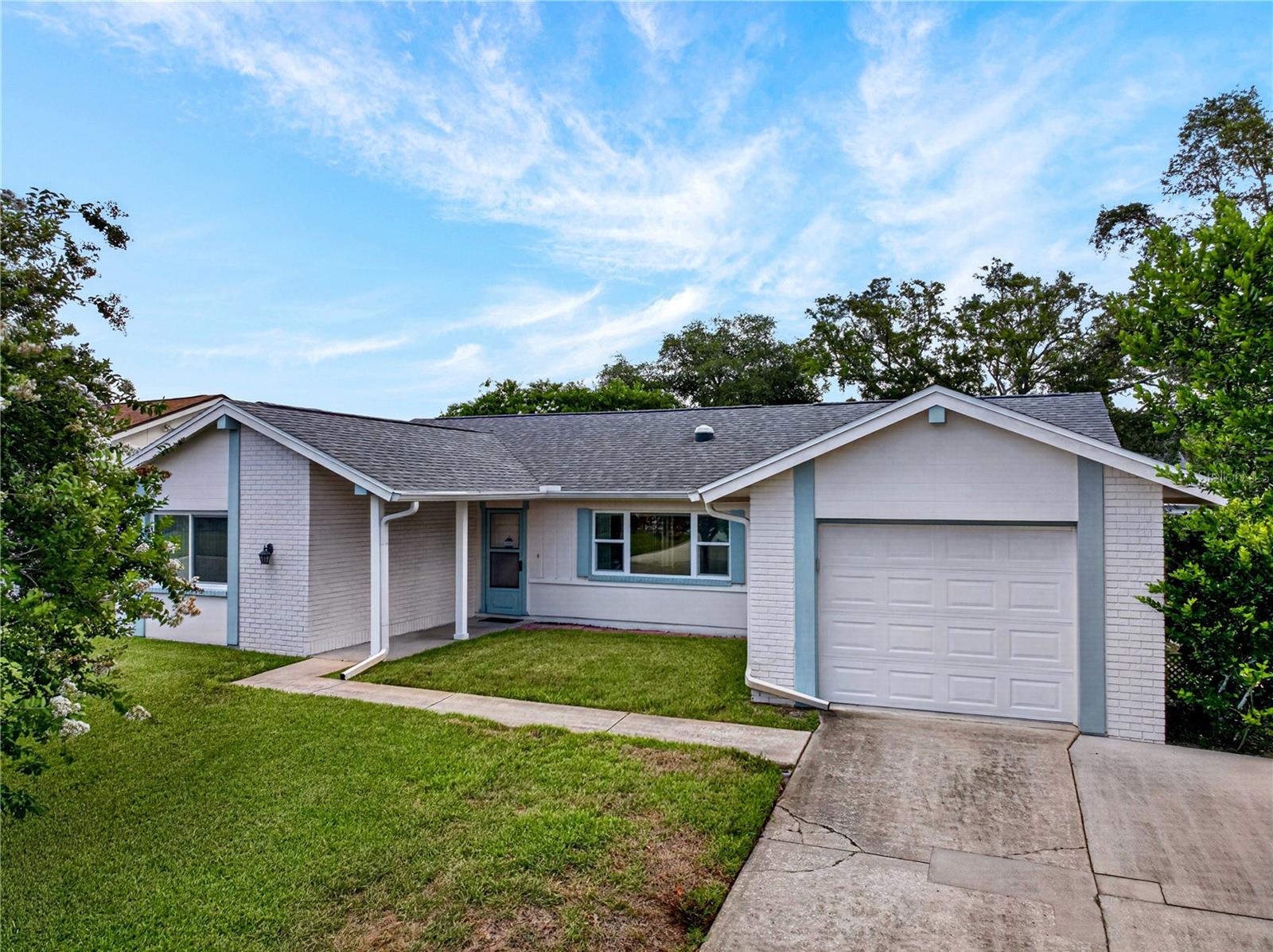 Welcome to your stress-free Florida lifestyle in the highly desirable Beacon Woods East community! This beautifully maintained 2-bedroom, 2-bath home offers over 1,800 square feet of comfortable living space, including a massive 432-square-foot bonus room with two closets that could easily serve as a home office, hobby room, fitness space, media room, or guest retreat.  From the moment you arrive, you'll appreciate the pride of ownership and extensive updates already completed for you. Freshly painted and completely carpet-free, the home features durable laminate flooring throughout most living areas, creating a clean, cohesive look that is both stylish and easy to maintain. Three solar tubes fill the home with abundant natural light, creating a bright and inviting atmosphere throughout the day.  For added peace of mind and potential insurance savings, major improvements have already been completed, including a 2019 roof with third nail mitigation, a 2023 HVAC system with UV light and updated ductwork, and hurricane impact windows and doors throughout. Additional upgrades include updated white kitchen cabinetry, a water softener, charcoal filtration system, reverse osmosis drinking water system, alarm system, newer water heater thermostat, Cat 5 exterior door screens, solar screens, and a fully functional irrigation system supplied by well water.  Beyond the home itself, Beacon Woods offers an active yet affordable lifestyle with a low HOA fee that includes access to a community pool, tennis courts, clubhouse, and a full calendar of social events and activities. Conveniently located just minutes from Hudson Beach, shopping, restaurants, medical facilities, and approximately 35 minutes from Tampa International Airport, this location offers the perfect blend of relaxation and accessibility.  If you've been searching for a move-in ready home where the major updates have already been completed, this is one you won't want to miss. Schedule your private showing today!