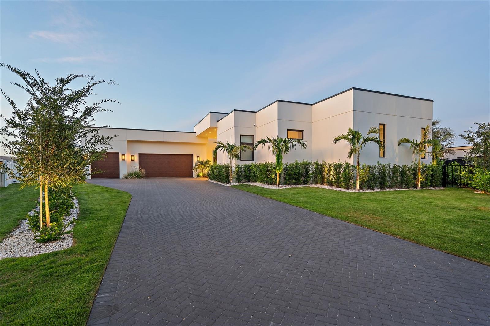 If you’re truly ready for the very best, this is your next destination.

Commanding a premier position on Tierra Verde’s Grand Canal, 501 Barcelona Drive is a trophy residence for those who demand architectural excellence, privacy, and an exceptional waterfront lifestyle. Behind its clean modern lines lies a home designed for how you truly want to live—with world-class entertaining and elevated day-to-day living unfolding seamlessly across one impeccably built level. From the disappearing-edge pool to the curated finishes, every detail is conceived to inspire and impress.

This nearly new custom build, completed in 2024 by its current owners, was designed with a visionary use of form and texture by Mandy Vallowe; simply to be in it evokes a rare fusion of sophistication and serenity. Indoor spaces flow into luxurious outdoor living, complete with a deluxe outdoor kitchen and a disappearing-edge waterfall framed by a true boater’s paradise.

The kitchen is a showcase of refined performance and elegance, centered around a dramatic island wrapped in honed Calacatta Borghini marble. It features a gas cooktop, convection oven, and microwave—all by Gaggenau—alongside a built-in Sub-Zero refrigerator and dual sets of Fisher & Paykel dish drawers. Finished with exceptional craftsmanship, the space is equally suited to daily living and luxury entertaining. Behind the kitchen, a spacious butler’s pantry offers added counter space, generous storage, and a secondary refrigerator/freezer.

The construction is nothing short of extraordinary. Built by Crescent Homes—an award-winning firm with over 5,000 residences completed—the home was engineered with a commercial mindset rarely applied to residential builds. All-block construction, cast-in-place concrete beams (many with #8 rebar), commercial ES-rated windows, and 159 deep pilings beneath the home and 30 more beneath the pool deck form a structural core more akin to a boutique hotel than a residence. Level 5 smooth-finished walls offer gallery-quality surfaces ideal for art.

The home, patio, and elevated infinity-edge pool all reside on the same plane—enhancing resilience, ensuring privacy from passing boats, and allowing interior and exterior spaces to function as one. Over half a million dollars was invested in structural elements that remain unseen yet deeply felt, contributing to the home’s exceptional quiet, strength, and peace of mind. A built-in bar anchors the living space, offering a sophisticated setting for entertaining with ease.

A fully automated Control4 system manages lighting, shades, audio, climate, security, and accent lighting—easily operated via custom remote or app.

A 36kW solar energy system offsets nearly all power bills and feeds power back to the grid.

Located on Tierra Verde’s Grand Canal—some of the most coveted boating water on the Gulf Coast—the property’s dockage, with slip and lift, offers near-instant access to the open Gulf and Intracoastal at one end and Port32 marina at the other.

Tierra Verde is a private island community perfectly positioned between the Gulf’s award-winning beaches and the vibrancy of downtown St. Petersburg—with fine dining, acclaimed museums, waterfront parks, and international airports all nearby.