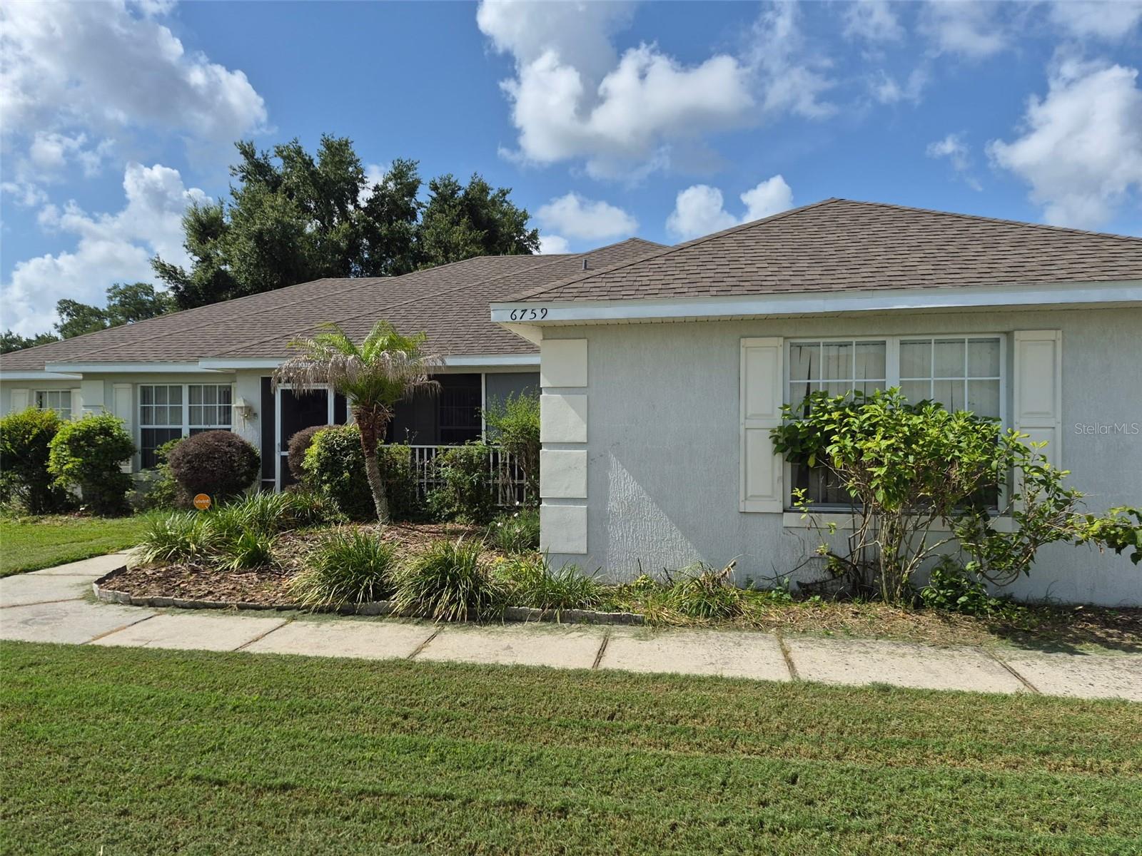 This spacious 4-bedroom, 2-bath home features a desirable side-entry garage and a thoughtfully updated kitchen with rich wood cabinetry. Enjoy peaceful views with no rear neighbors, offering added privacy and tranquility. Major upgrades provide peace of mind, including a roof replacement in 2023 and a new A/C system installed in August 2024. The primary suite includes a comfortable sitting area, dual walk-in closets, and a spacious master bath with double sinks, a walk-in shower, and a garden tub.  
A standout feature is the expansive 32' x 13' Florida room, currently used as a home gym—ideal for entertaining, relaxing, or flexible living space.  Additional highlights include a formal dining room and a versatile bonus room that can serve as a den or optional 5th bedroom, adapting easily to your needs.