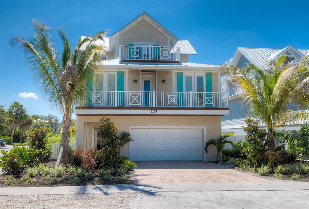 Welcome to "Absolute Paradise" at 217 Magnolia Ave! This wonderful property that features 5 Bedrooms and 4 Bathrooms, a private tropical pool and spa, covered patio and multiple outdoor decks including a rooftop deck with amazing 360 degree views of Anna Maria island and the sparkling blue waters of the Gulf of Mexico. This home offers bright open living space; Large open kitchen with granite counters, breakfast bar and stainless steel appliances. Large family and dining room to accommodate many family members and guests. The bedrooms are spacious and most are en-suite with access to outdoor decks. In addition to the over 2,500 sq ft of indoor living space, You get the incredible outdoor entertaining space and amenities. Lounge, Grill and Relax by the tropical pool and spa, Take the spiral stairs to the multiple decks and then to the rooftop for some picture perfect sunsets! Go for a short stroll directly down the block to Ginny and Jane E's or straight to the world class beaches at The Gulf of Mexico. There is so much more; only minutes to bustling Pine Ave boutique shopping, great restaurants, The Community Center, AMI City Pier and the Bayfront! Plenty of storage for all your beach toys, golf carts and guest parking. This is a perfect 2nd vacation home and or  excellent rental investment property! Don't hesitate, own your Piece of Paradise today before it's gone!